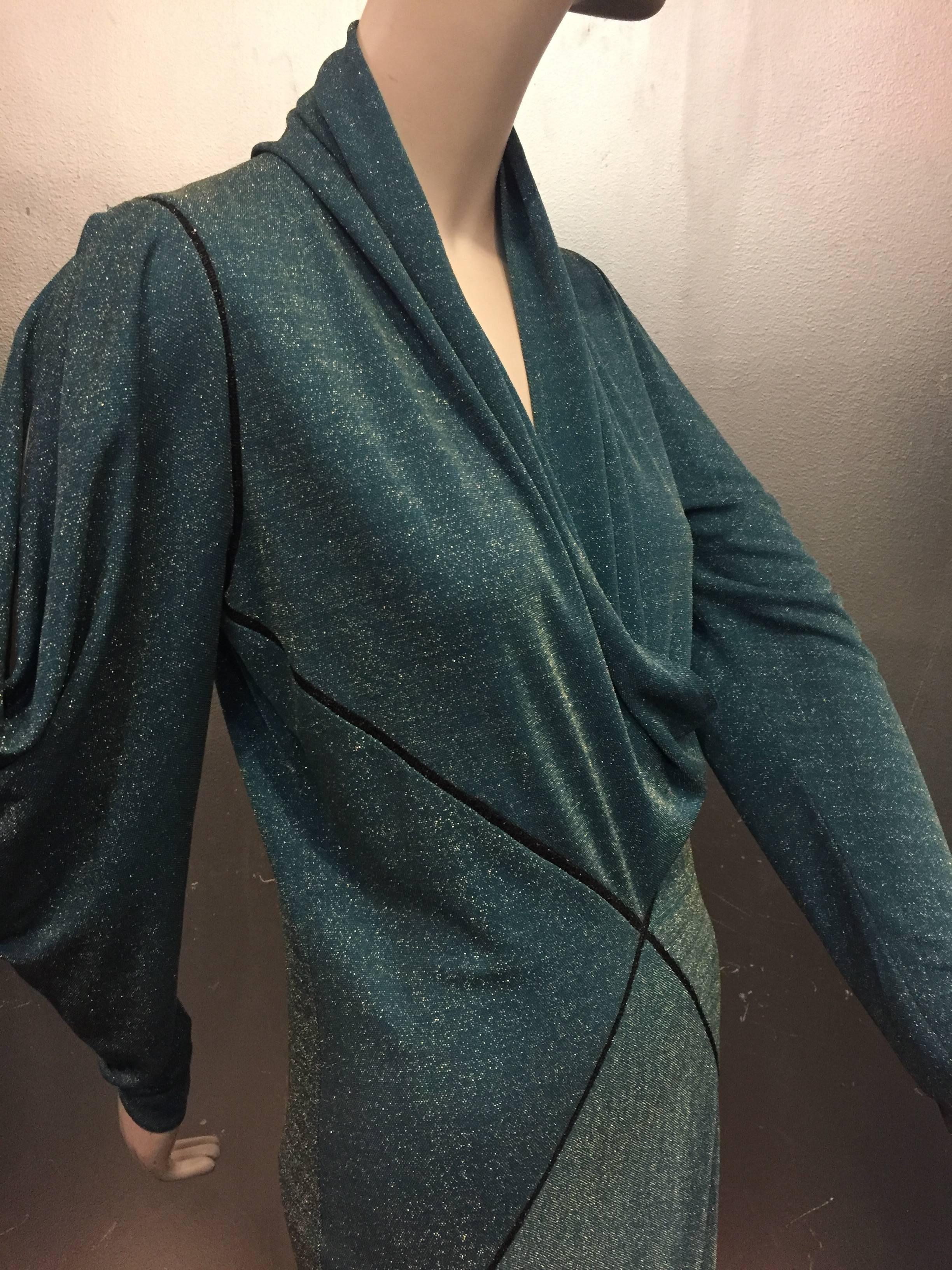 A gorgeous early 1980s Janice Wainwright teal and silver lurex jersey gown with bias draped neckline, sleeves and hem, all arranged in a harlequin diamond design trimmed in braid at seams. 