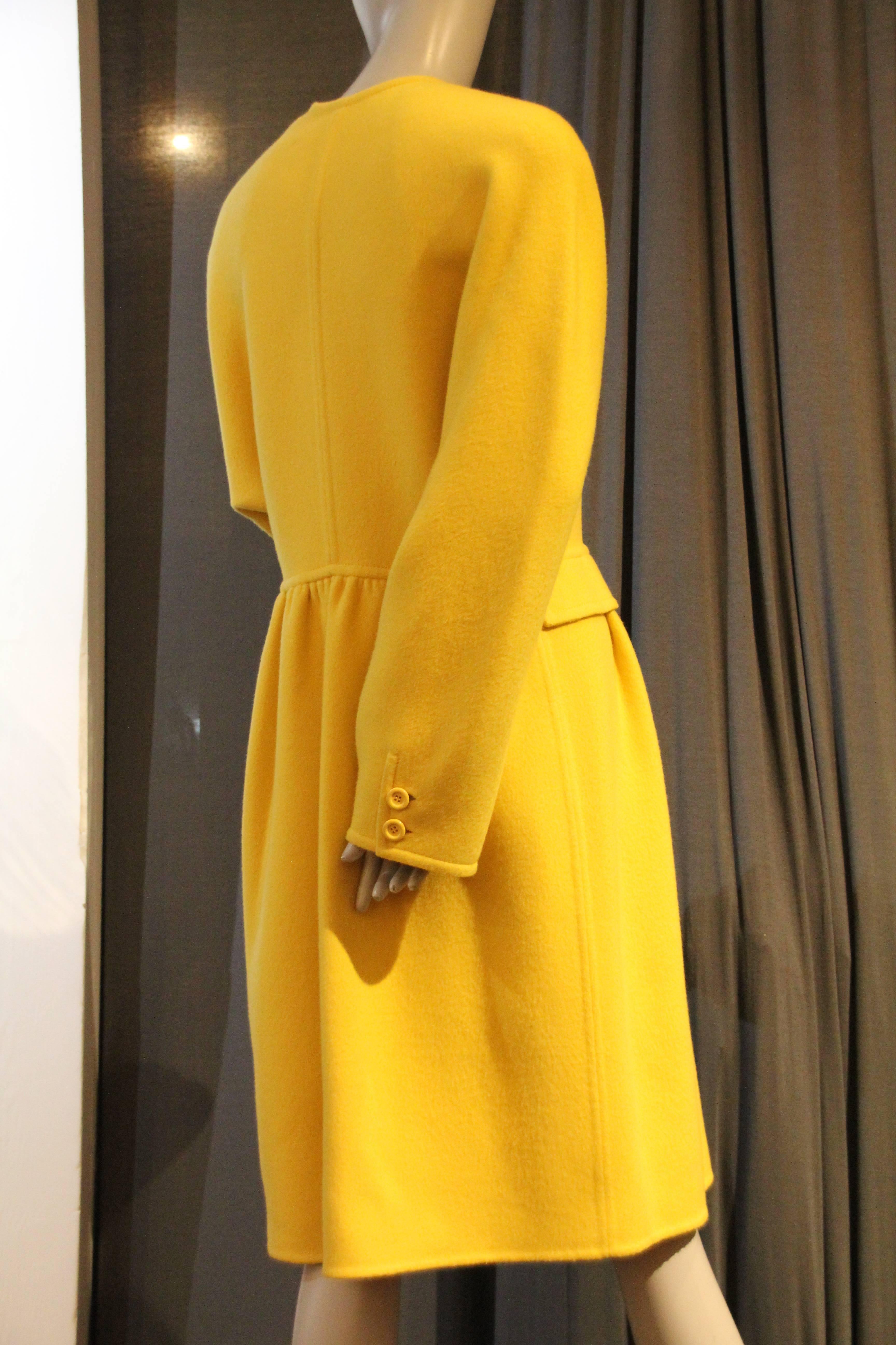 A gorgeous Valentino Couture canary yellow double-faced cashmere double-breasted coat with gathered and flared skirt and front pockets.  No collar-jewel neckline. 