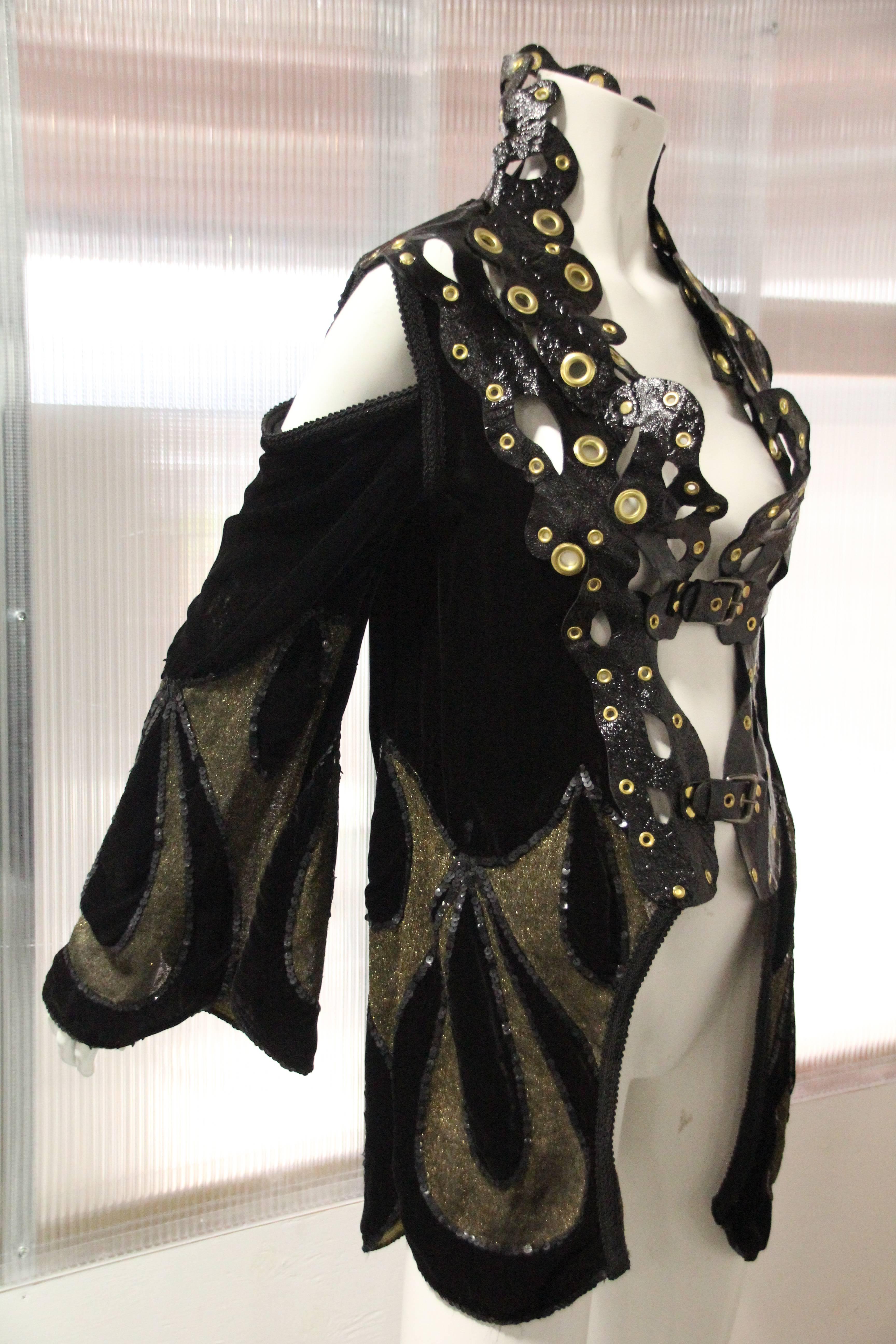 Avant Garde reconstructed 1920s Art Deco silk velvet cut-away opera coat with sequin trimmed gold lame teardrop motifs at hem and flared sleeves,  Patent goatskin piecework high Elizabethan-style collar and front buckle closures under bust and at