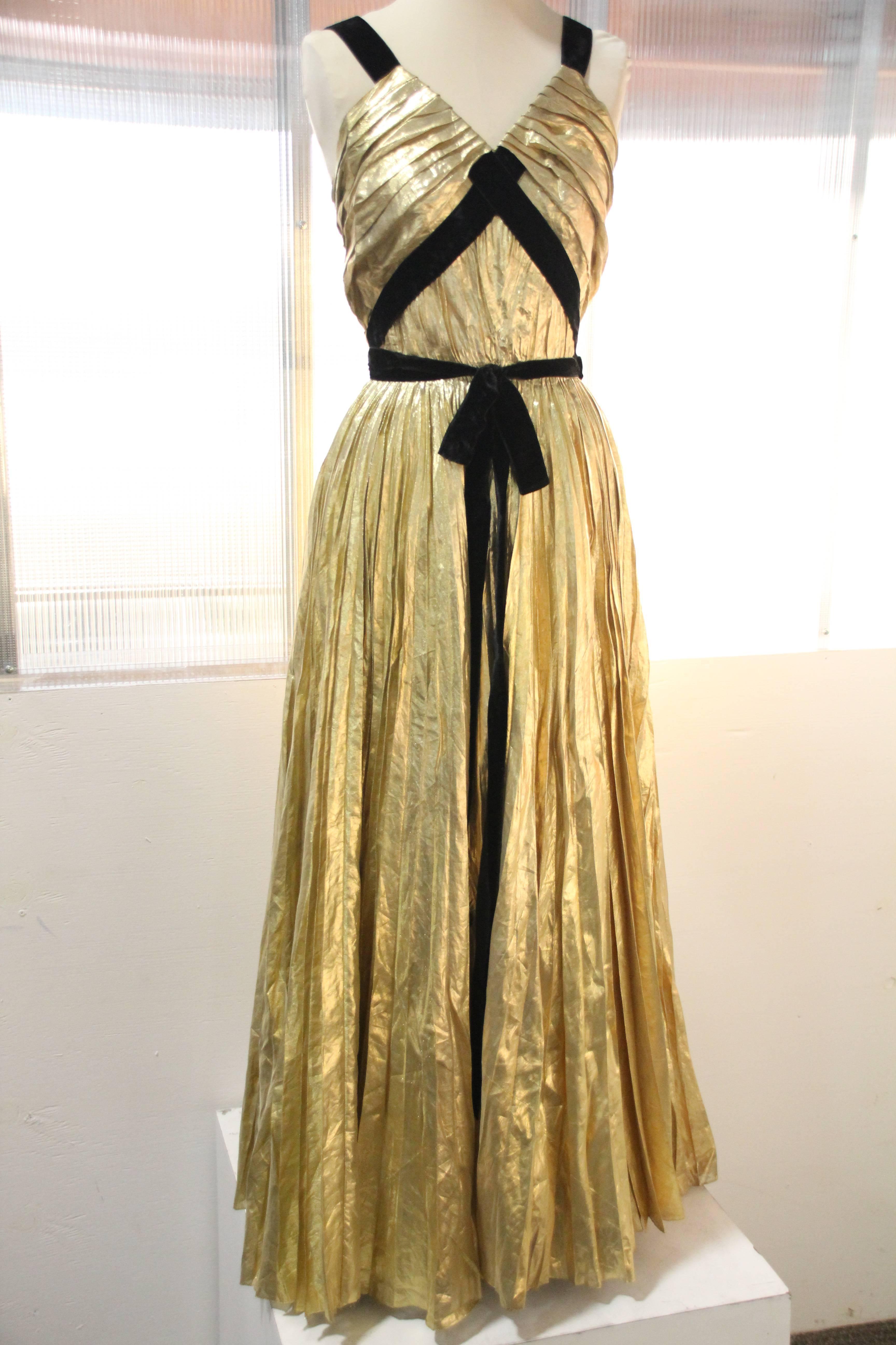 1940s Max - Madrid voluminously sunburst pleated gold silk lame foil Goddess gown with black silk velvet criss-cross straps and bow at front. Fully lined. Side zipper. Stunning !