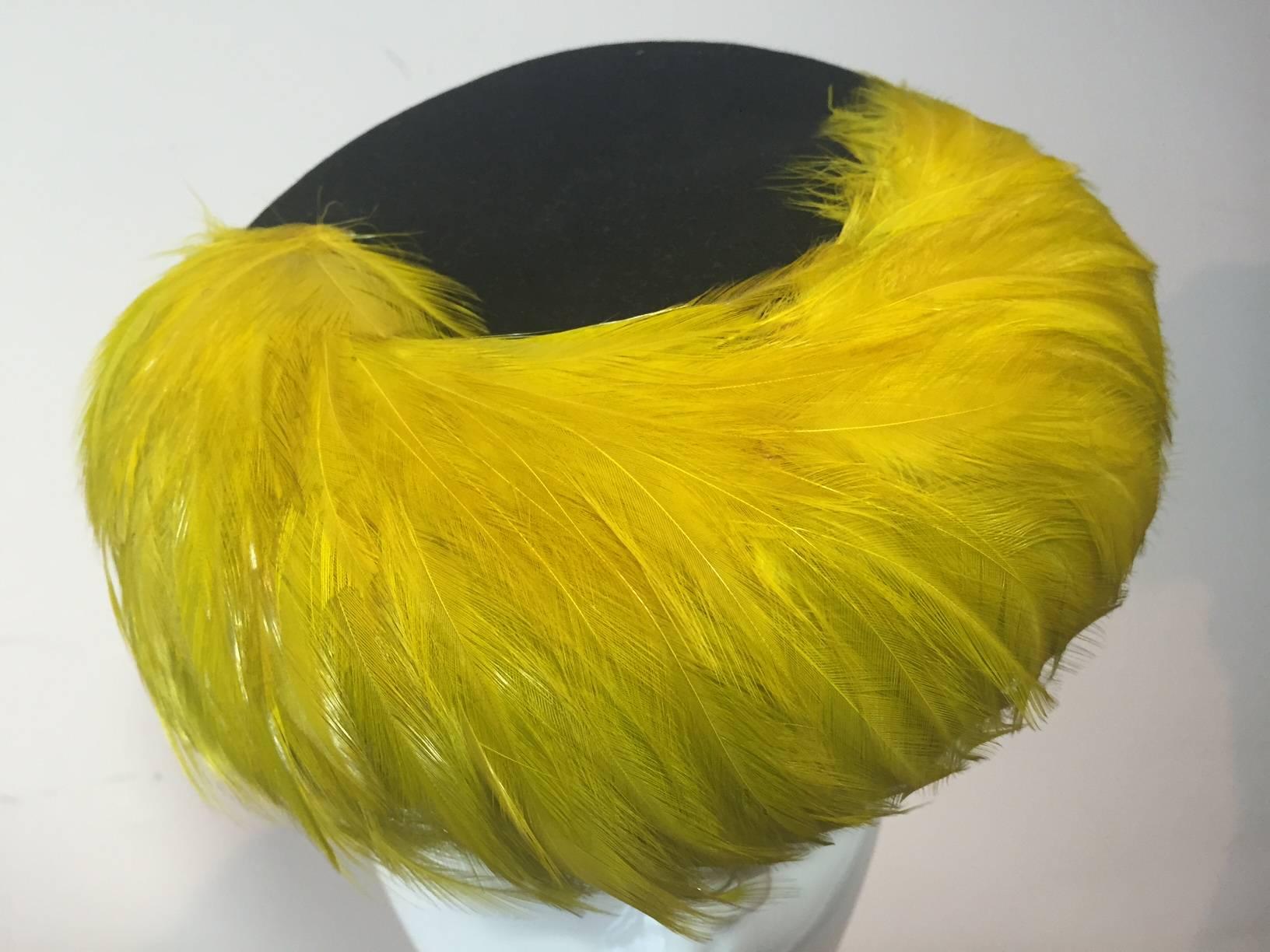A stunning 1940s chartreuse coq feather tilt hat.  Looks like a 1940s style front hair roll!  One size fits all. Wool felt body and back ring