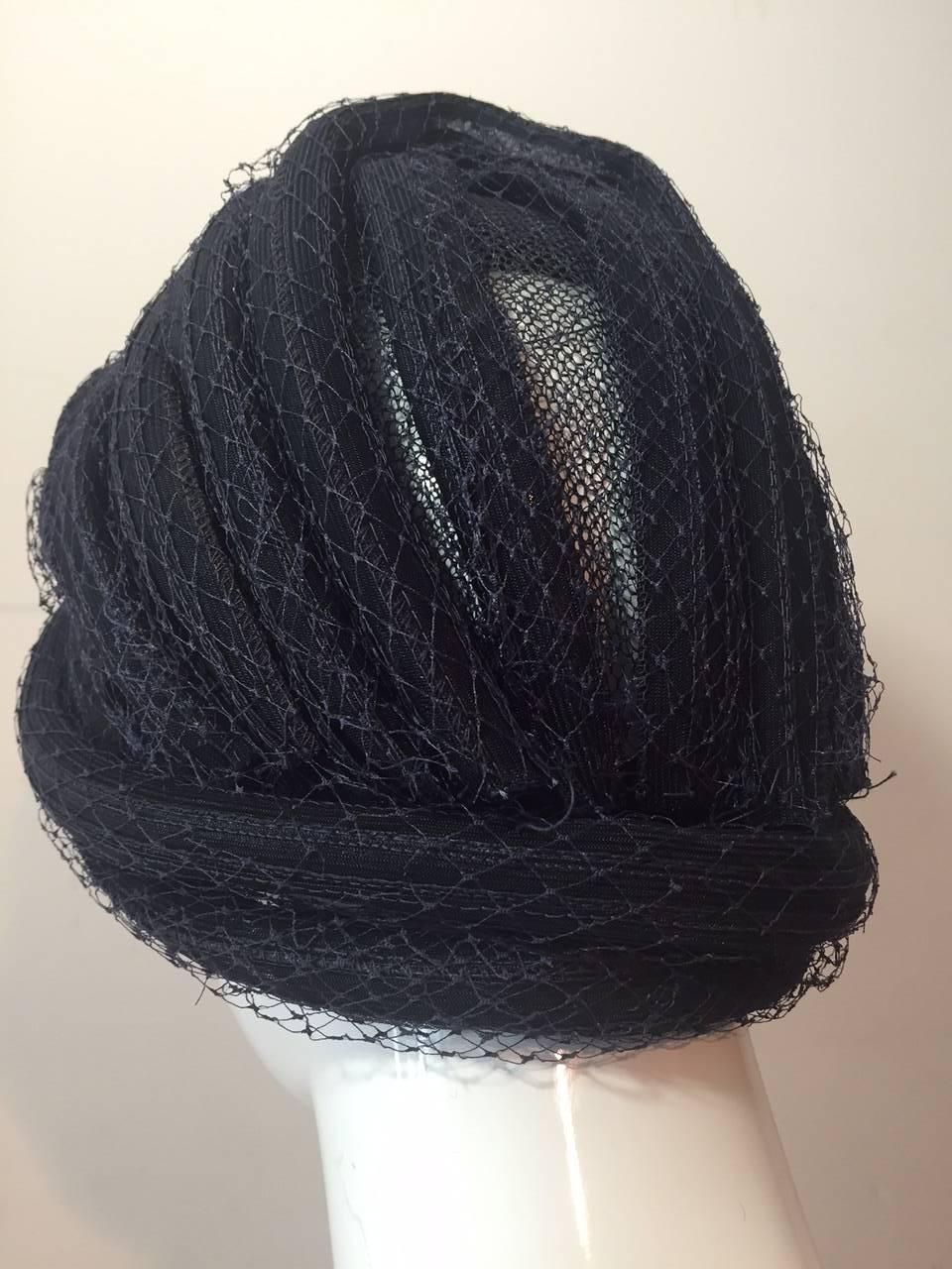A beautiful 1960s navy blue straw and tulle Christian Dior turban.  