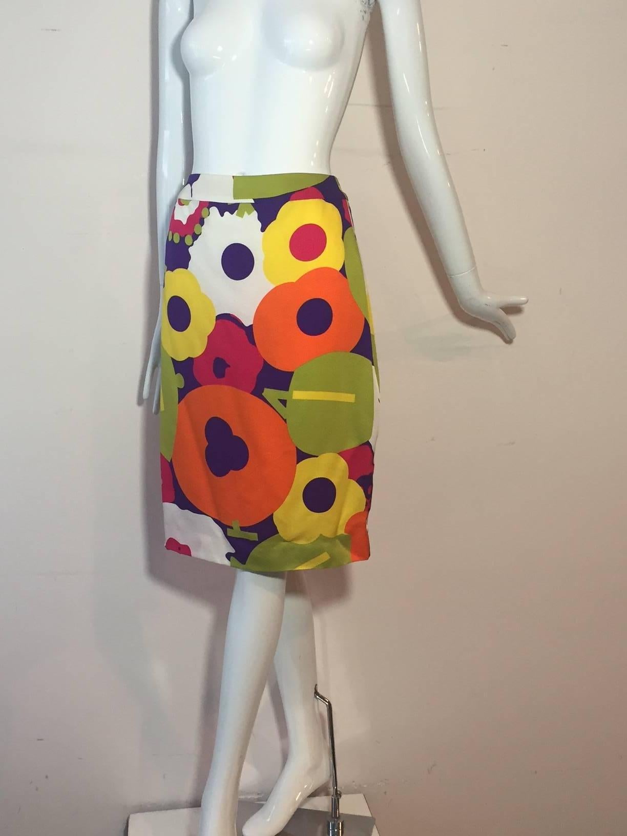 A great Chanel 2000 Pop-Art style floral print mini skirt in a silk faille--like men's tie fabric.  Chanel logo is found in print as well as on button at waistband. Unlined.