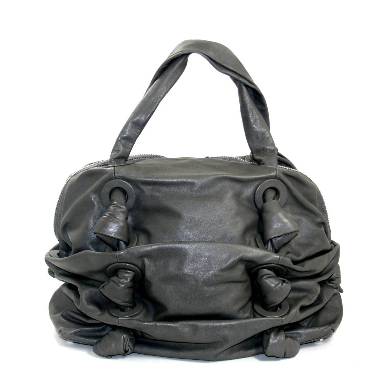 In better than excellent condition, this Slate Grey Leather Zuma Satchel from the Michael Kors Runway Collection  is a fantastic find for a savvy shopper, retailing for over $995.00 with taxes.  It is basically pristine other than some light spots