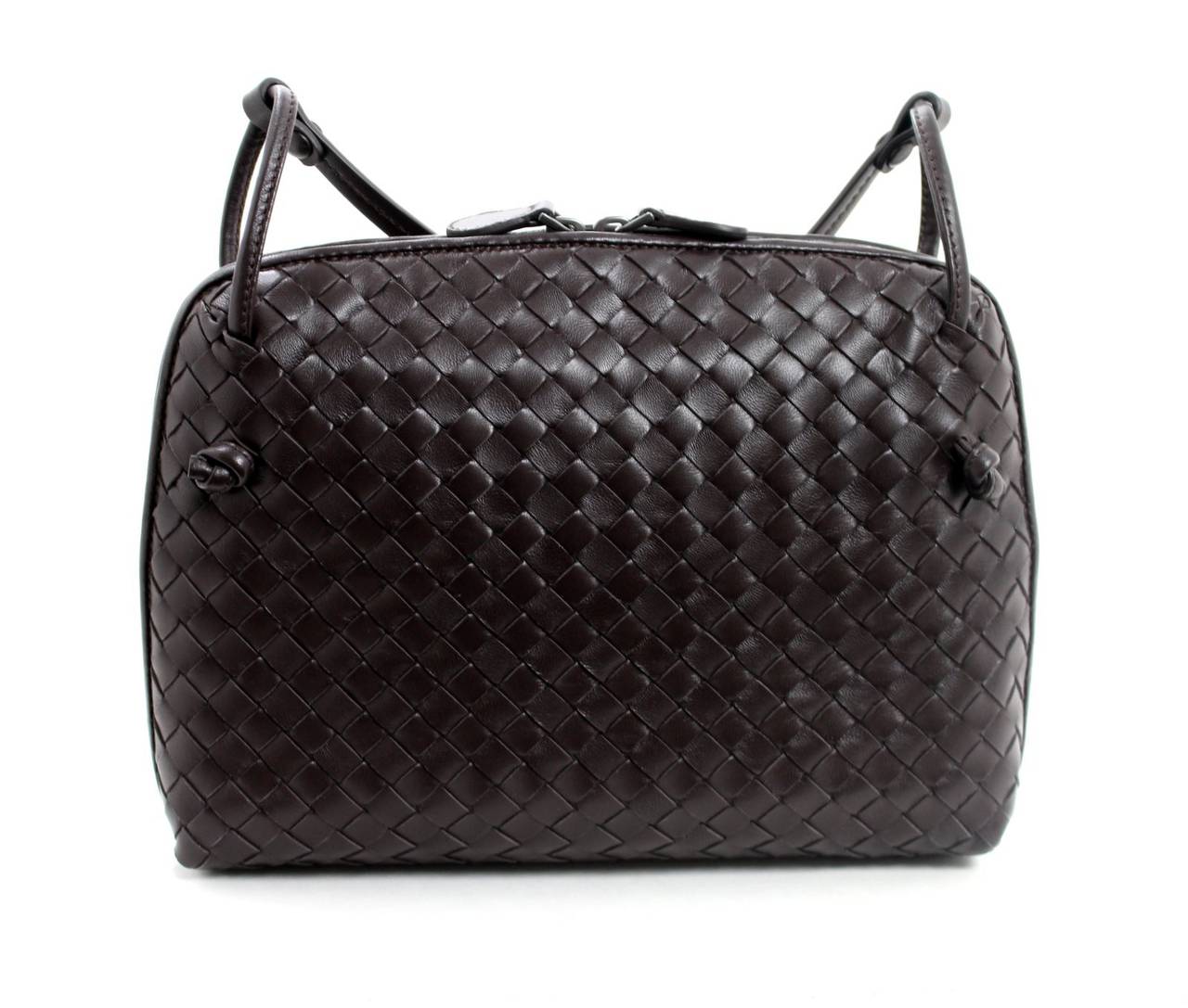 Brand new, this Bottega Veneta Ebano Intrecciato Leather Cross Body is from the current collection and retails for over $1,450.00 with taxes. Fashionably smaller in size, it comes in a variety of colors though neutral deep brown is a smart addition