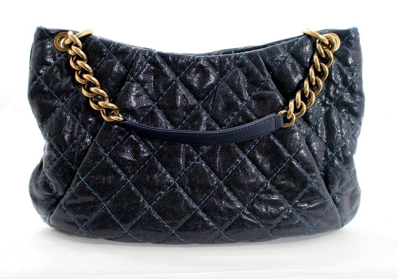 Versatile and stylish, this Navy Caviar Leather Coco Pleats Hobo is a fantastic find in basically pristine condition.  It appears to have been carried one time, if at all.    It easily converts from a shoulder tote to a hands free cross body style