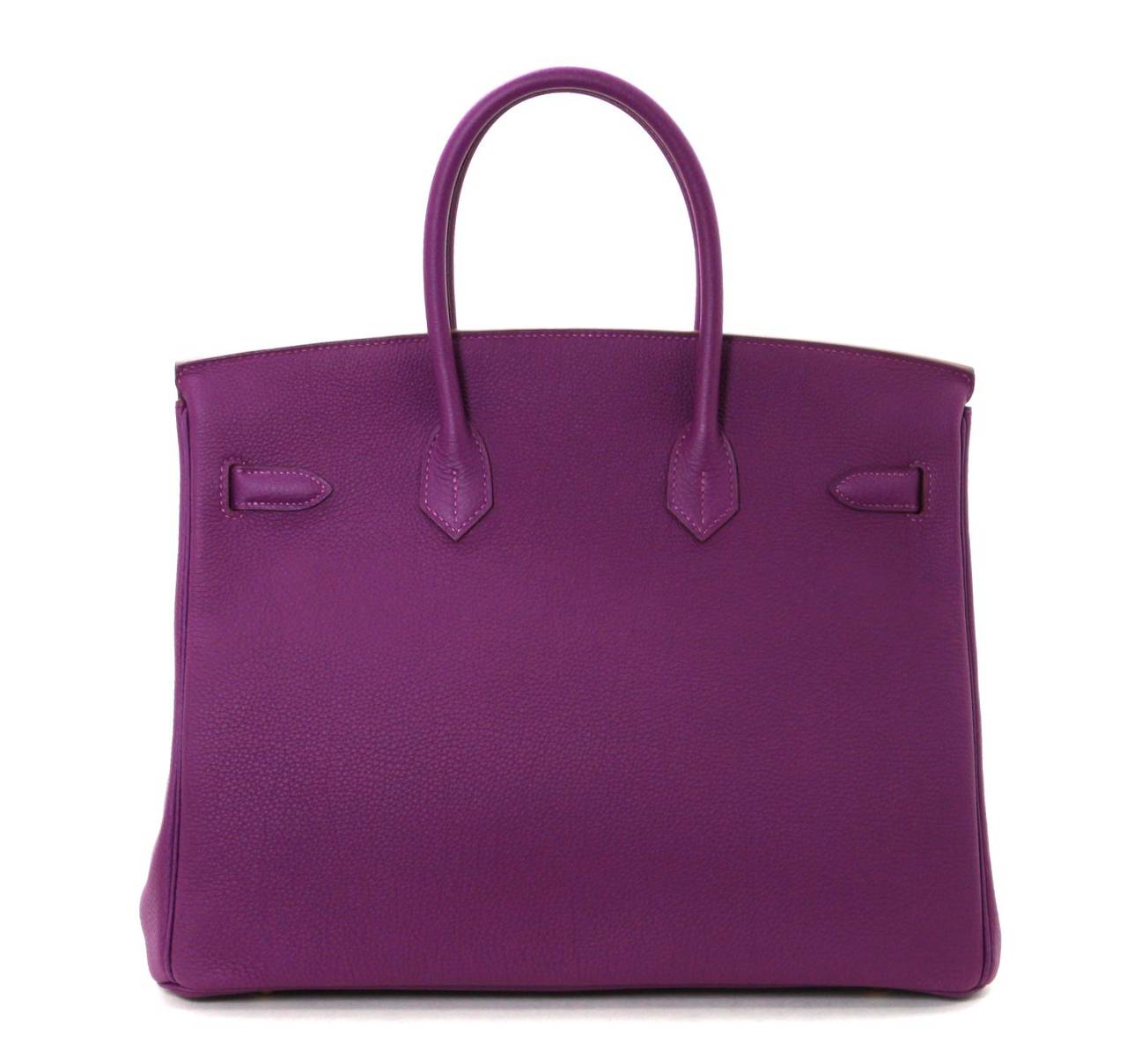 Pristine, new and never carried Hermès Birkin Bag in Anemone Togo Leather, 35 cm size.   Crafted by hand and considered by many as the epitome of luxury items, Birkins are extremely difficult to get. Scratch resistant and beautifully textured,