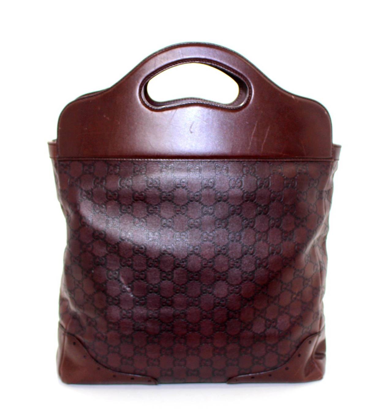 In good condition with light signs of prior ownership, this Dark Brown Guccisima Leather Tote from Gucci  is  perfect for daily use.  Each of the corners has small scratches as well as the smooth leather of the cut out handle area.    The interior