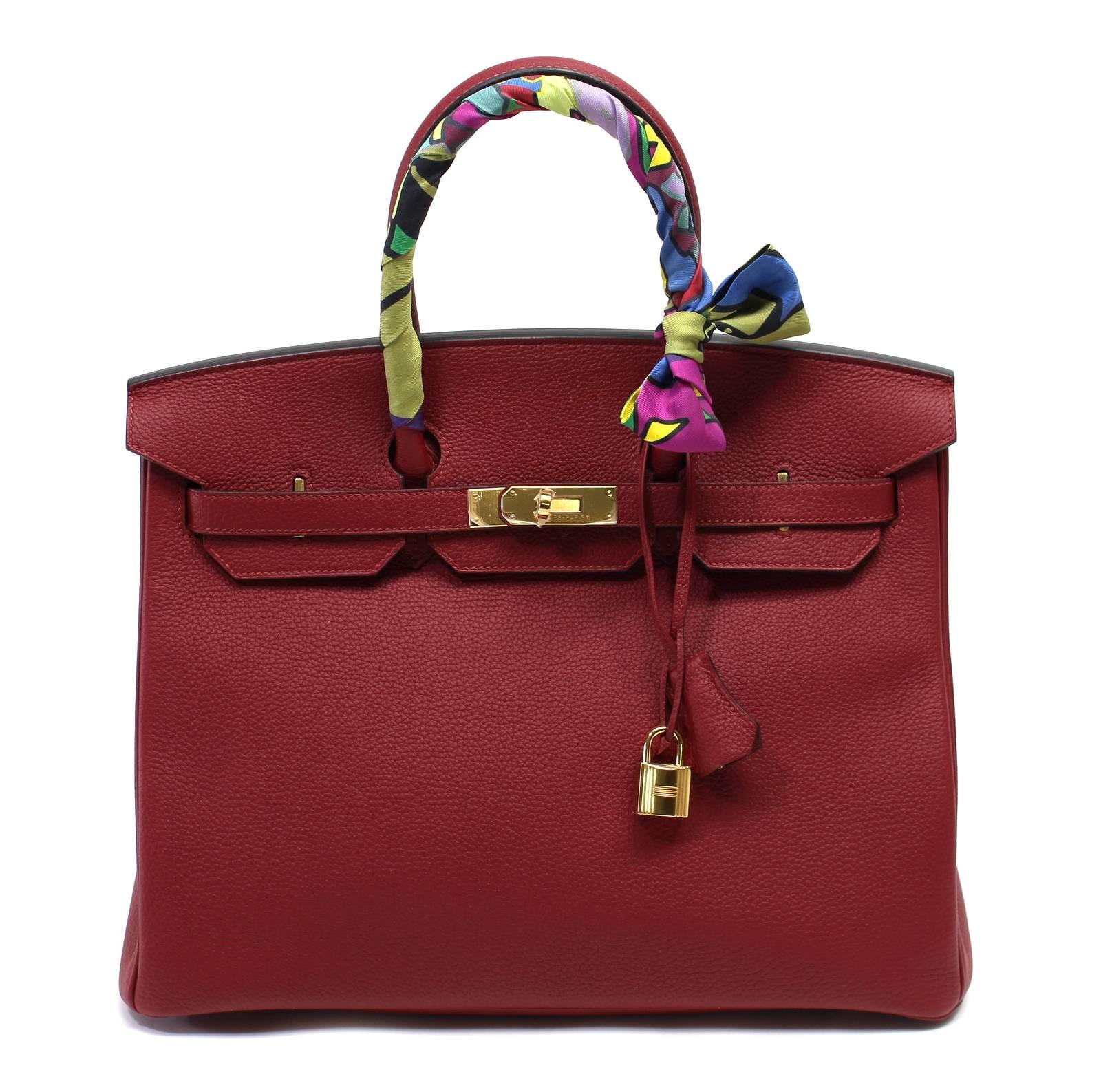 Pristine, store fresh condition (plastic on hardware) Hermès Birkin Bag in ROUGE GRENAT Togo Leather, GHW 35 cm, x stamp
Purchase includes padlock, keys, clochette, protective felt, raincoat, dust bags and Hermès box with tissue.  Twilly NOT