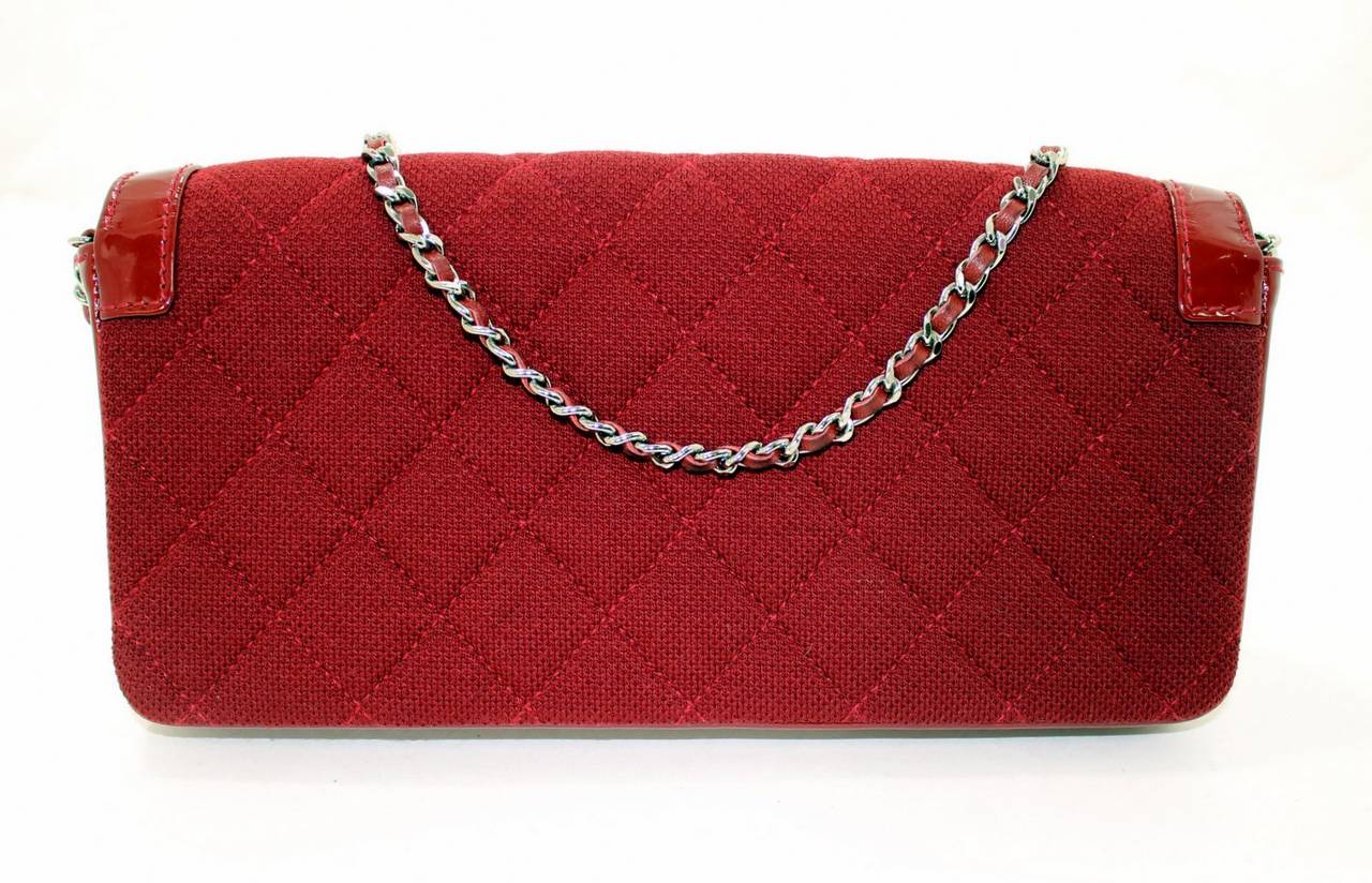 In mint overall condition, this Dark Red Jersey Flap Bag from Chanel is a great find for a savvy shopper.    There are no significant signs of wear to report as can be seen in our photos.  It’s well sized for day or evening and converts to a clutch,