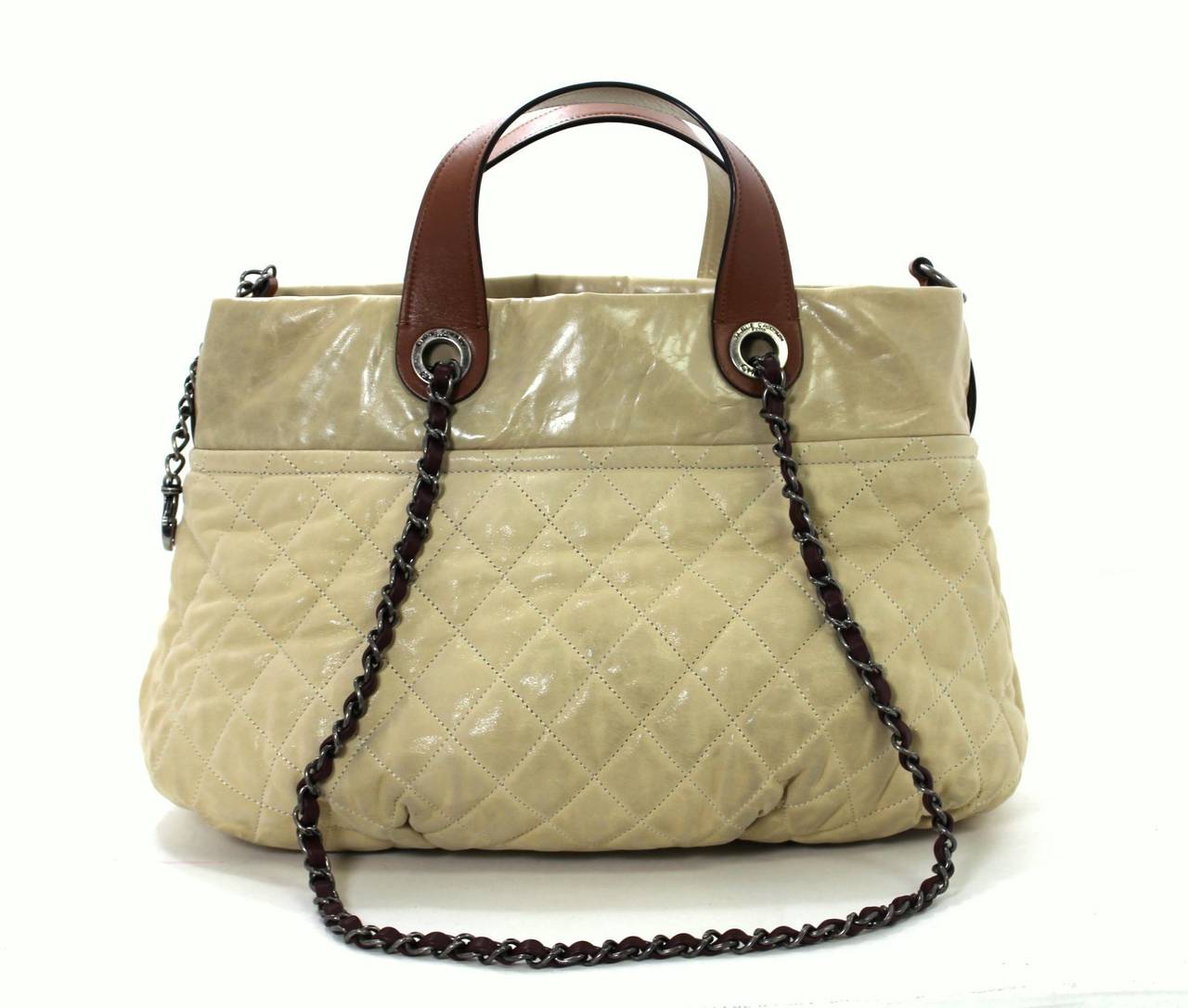 In very good condition, the Chanel Beige in the Mix bag is a unique style easily blending texture and pattern.  Previously owned, it has areas of darkening due to normal use and the light color.  This is the large version that originally retailed