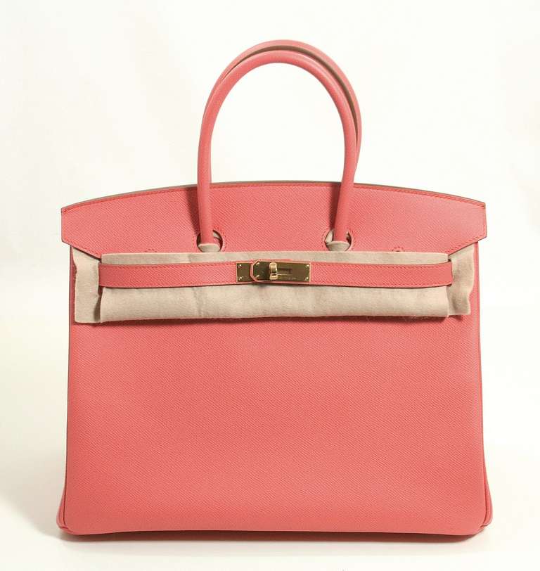 Never before carried, this 35 cm Birkin is a brand new Hermes color aptly named 