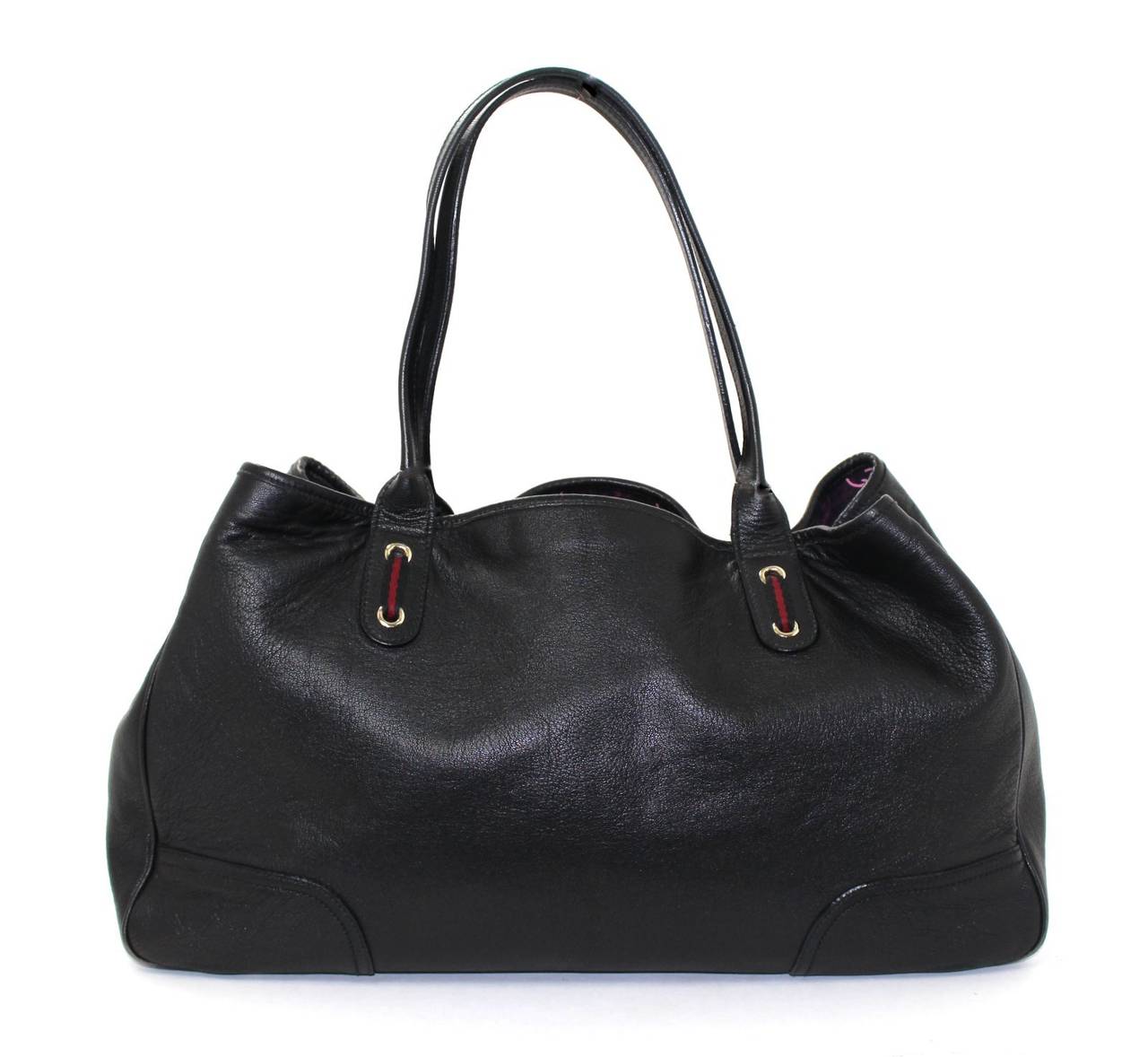 Gucci Large  Black Leather Tote - a great find in very good condition overall.  Very clean interior, exterior leather beautiful.  There is wear on all four corners; please see close up photographs. 
Roomy black leather tote has a soft texture and