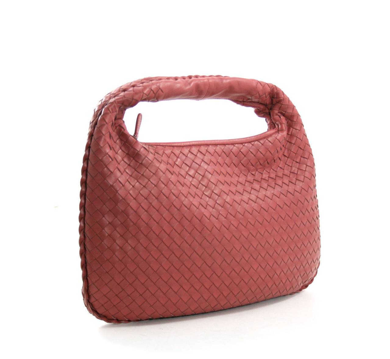 Bottega Veneta Rose Leather Medium Veneta Bag- Brand New, never before carried.  2013 color ROSE (pinky red); gunmetal hardware; intrecciato leather.
Zippered top, cocoa suede interior.  Made in Italy.
BV mirror and dust bag included.  Retail