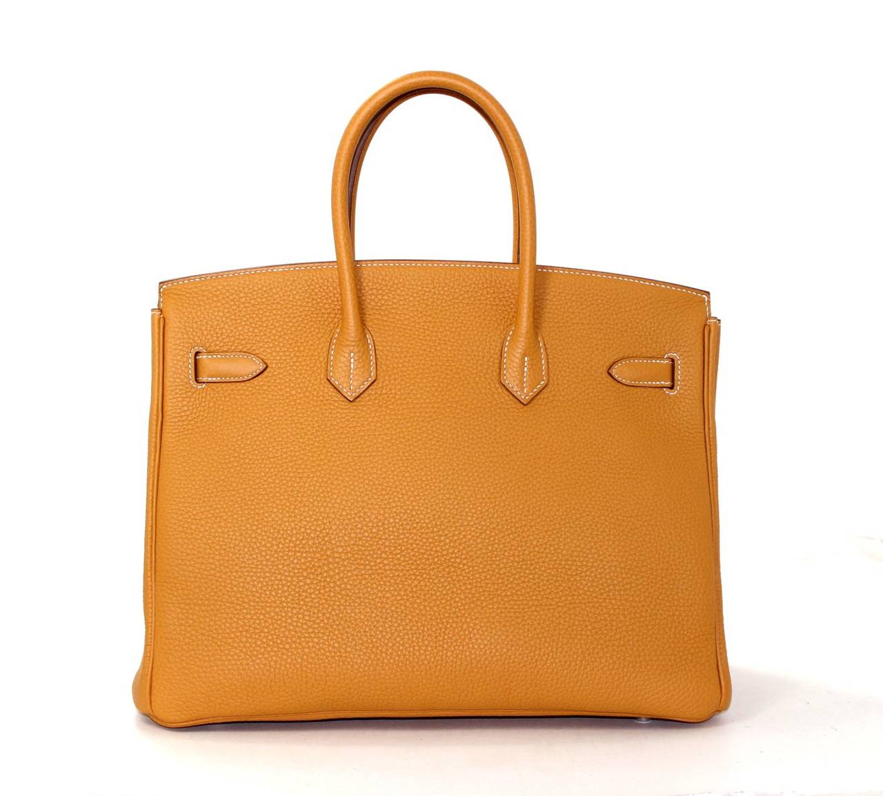 Pristine, store fresh condition (plastic on hardware) Hermès Birkin Bag in Sable Fjord Leather with Palladium, 35 cm size.   Crafted by hand and considered by many as the epitome of luxury items, Birkins are extremely difficult to get. Scratch