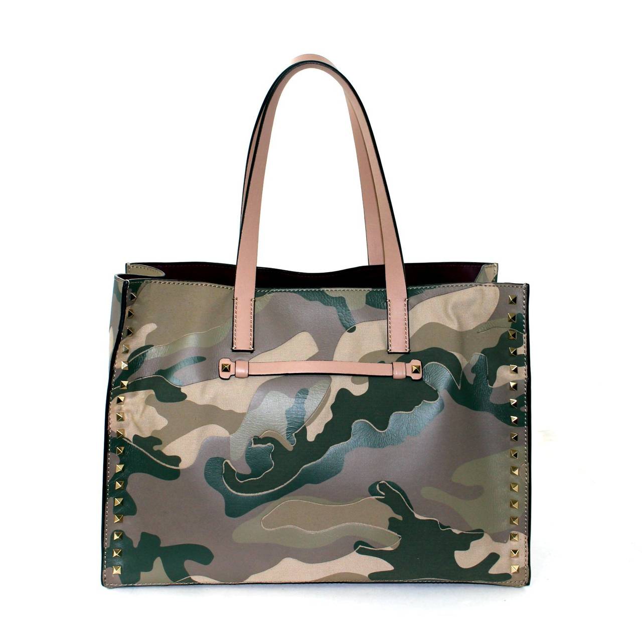 NEW Valentino Garavani Khaki Green Camo Rock Stud Tote Bag

Leather and canvas with gold tone studs
Magnetic snap closure; contrasting burgundy leather interior
Three interior zippered pockets; three open pockets
Beige leather straps carried on