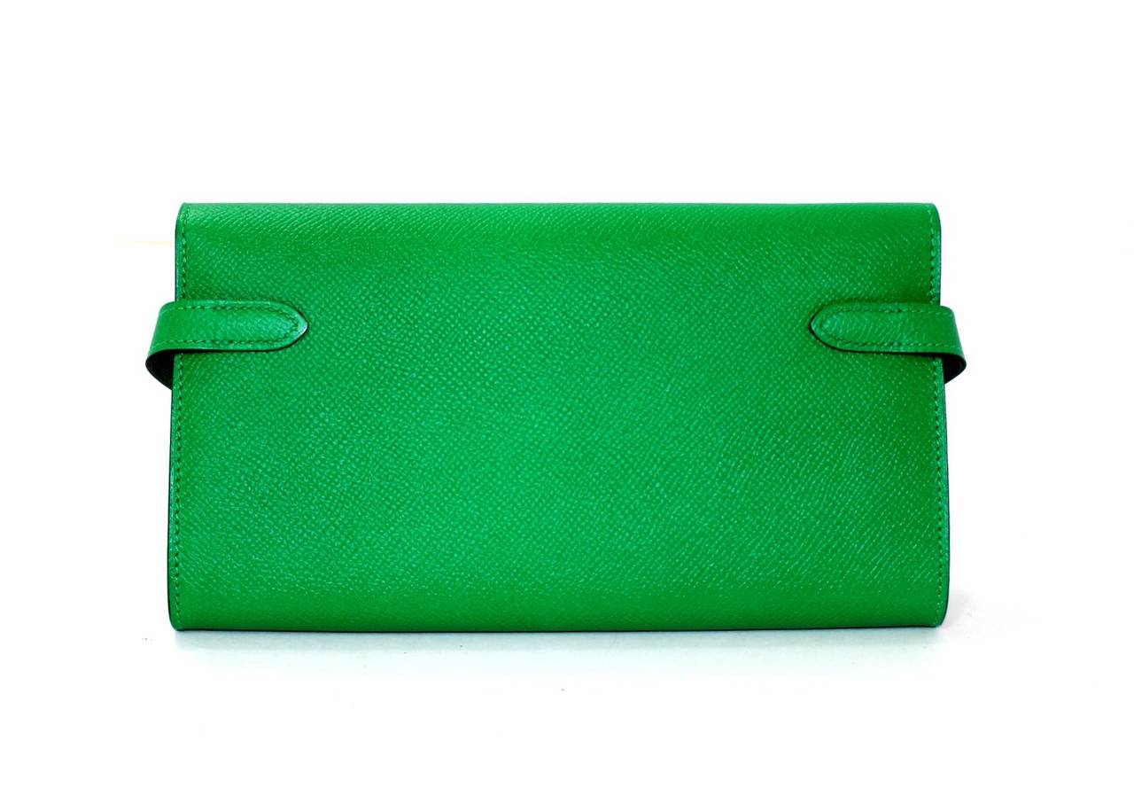 Versatile Hermes Kelly Wallet Clutch STORE FRESH, never carried, plastic on hardware.  In glorious Bambou (bright green) Epsom leather with gold hardware.

Vibrant Bambou green Epsom leather is highlighted with gold belted twist lock Kelly