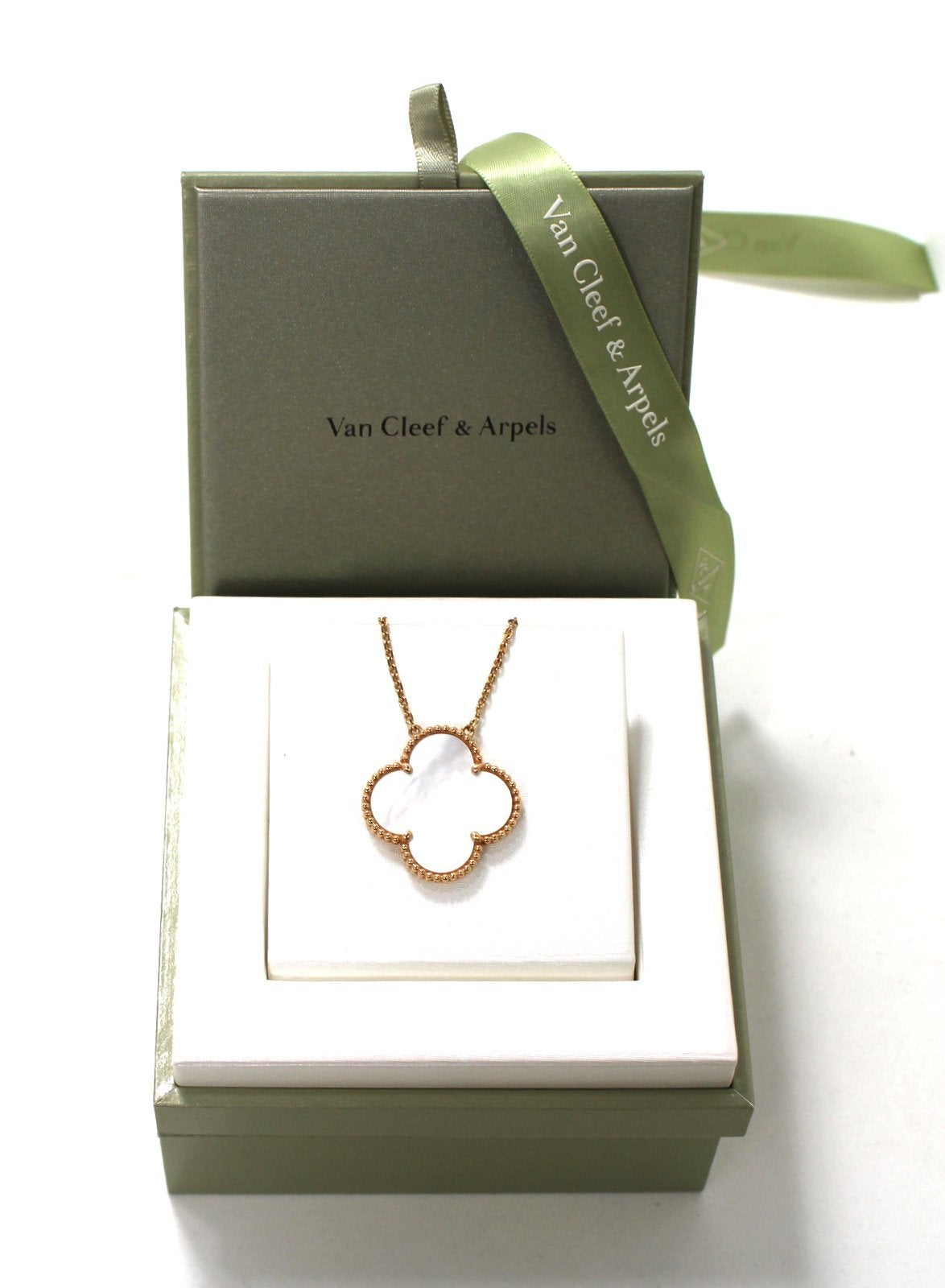 PRISTINE Van Cleef & Arpels Limited Edition Rose Gold Breast Cancer Awareness Alhambra Pendant  
  A white mother of pearl Alhambra pendant, signifying luck and health, is edged in “pink” rose gold.   Sixteen inch chain which can easily be extended