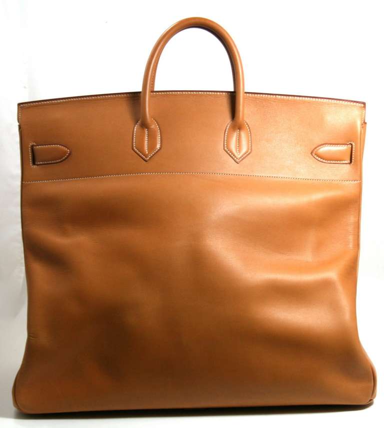 The rare and beautiful Hermès 50 cm Travel HAC is in better than excellent condition, just back from the Hermès spa.  Spending most of its life in storage and rarely carried, it has only some natural marring and creases due to the Vache Natural