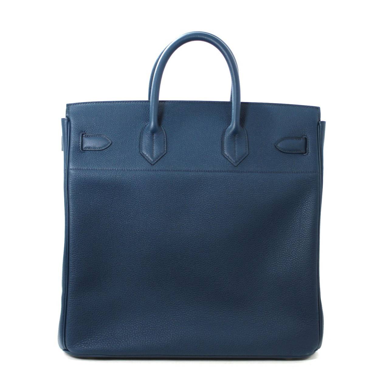 Pristine, store fresh condition (plastic on hardware) Hermès 40 cm Haut a Courroies in Bleu de Prusse Togo Leather with Gold Hardware.   Crafted by hand and considered by many as the epitome of luxury items, the HAC, or “high belts” bag, is