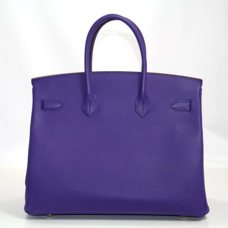 Pristine and never before carried, this Crocus Epsom 35 cm Birkin from Hermès still has the protective plastic intact on the hardware.    Hermès bags are considered the ultimate luxury item the world over.  Hand stitched by skilled craftsmen, wait