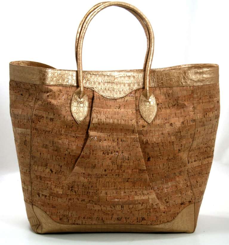 In nearly pristine condition, this no longer produced Nancy Gonzalez Cork and Crocodile Tote is a fantastic piece.  Carried less than a handful of times, there are only minimal signs of prior ownership.  The totally neutral style and unique