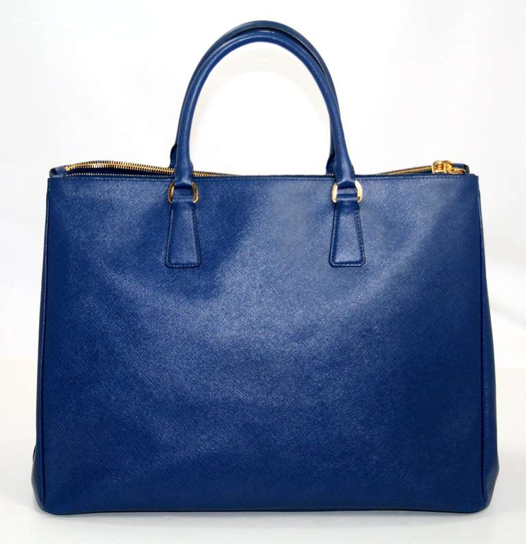 Prada’s Bluette Saffiano Leather Large Executive Tote is a current style retailing for over $2,580.00 with taxes.  This former store display is in pristine condition and an exceptional find for a savvy shopper.  The sophisticated style is elegant