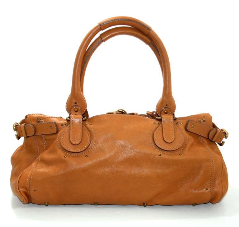 One of the most popular “IT” bags ever!  Chloe’s Whiskey Leather XL Paddington Bag is a brilliant find in excellent overall condition. There is a bit of light wear on the corners, though the interior remains spotlessly clean.   The Paddington is