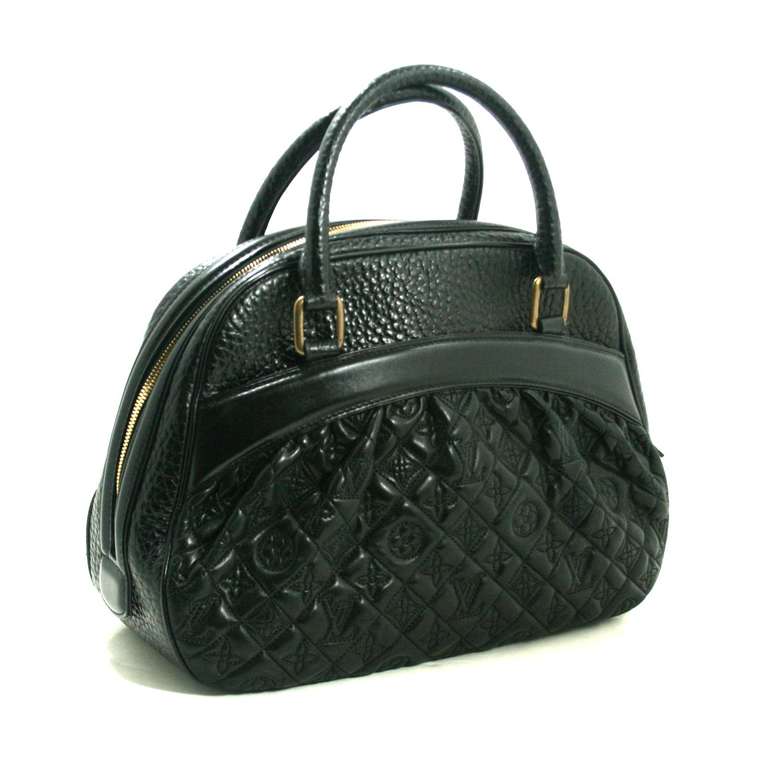 A stunning addition to any collection! This Louis Vuitton  Black Leather Mizi Vienna Satchel is in better than excellent condition.  The sophisticated limited edition is from the 2005 Runway collection.  There are some light scratches and mild mars