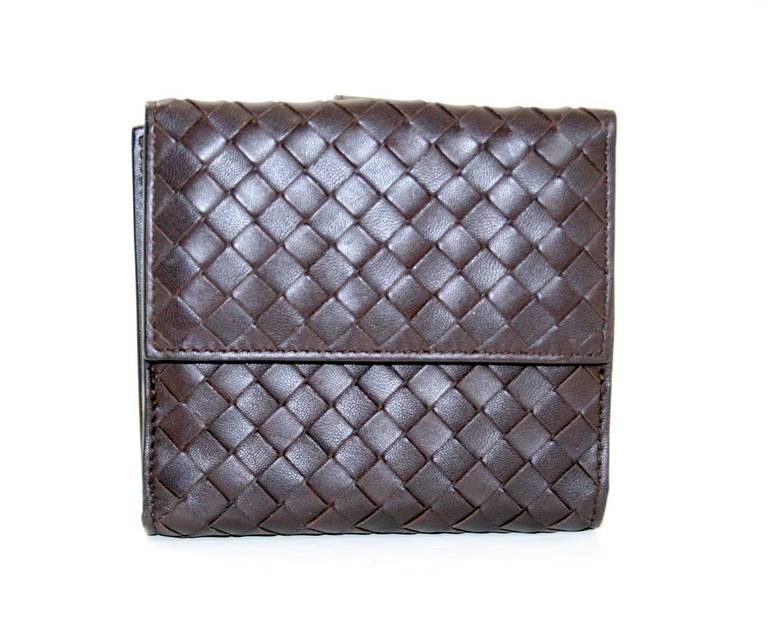 Bottega Veneta’s Brown Leather Bi Fold Wallet is both practical and stylish.  It is in pristine condition, appearing never carried.   Brilliantly designed, this compact wallet is equipped with the same slots for currency and coin as a large wallet. 