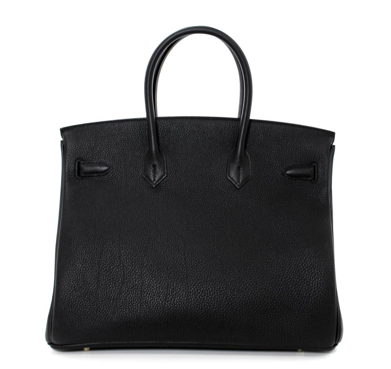 Pristine, store fresh condition (plastic on hardware) Hermès Horseshoe Birkin Bag in Black Togo Leather with Rose Jaipur, 35 cm size.   

Crafted by hand and considered by many as the epitome of luxury items, Birkins are extremely difficult to