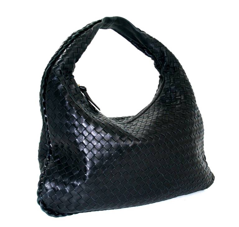 Bottega Veneta’s Nero Intrecciato Leather Medium Veneta Bag is a brilliant find in excellent condition.  There is very mild wear on one corner and a small mark on the interior lining.  Only noticed by the owner, these minor flaws do not detract from