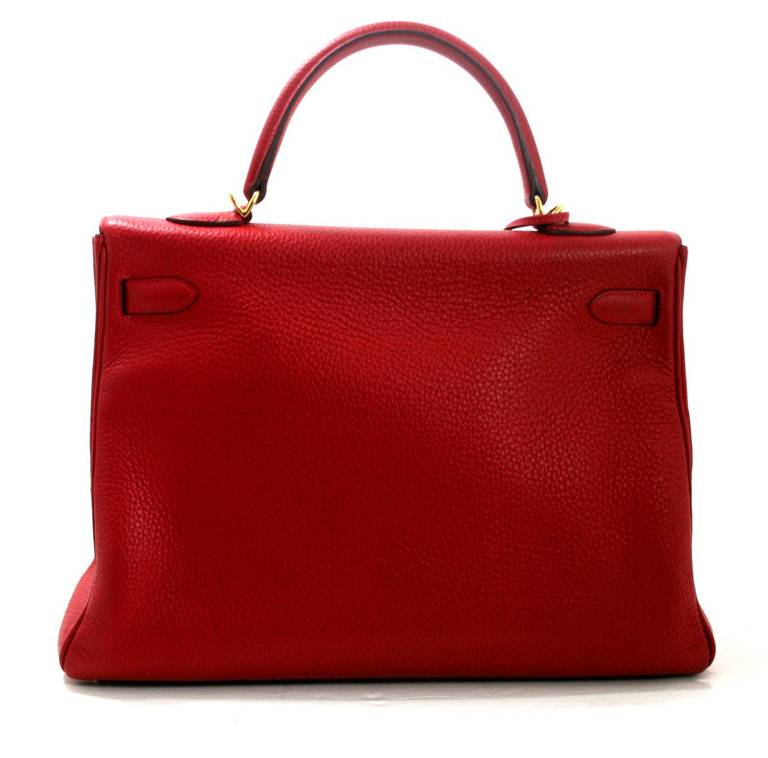 This Rouge Casaque (one of the most sought after reds from Hermès)  35 cm Togo Kelly is a brilliant find in excellent condition.  There is light corner wear and mild surface scratching on the hardware.  Please review photographs.   Hermès bags are