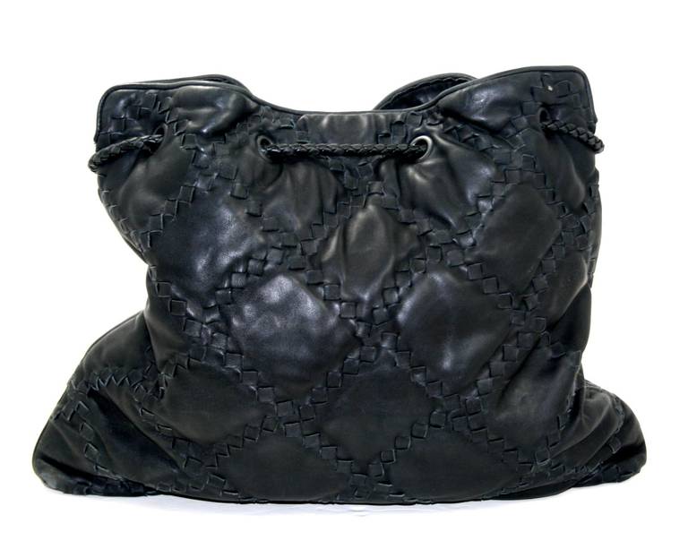 In excellent condition, this Bottega Veneta Black Leather Pyramid Tote is from the 2008 collection and retailed for approximately $2,300.00.  It has some wear to the corners but the rest of the leather looks beautiful as well as the interior.  The