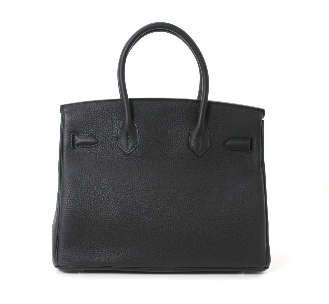 Pristine, store fresh condition (plastic on hardware) Hermès Birkin Bag in BLACK Togo Leather with Palladium hardware, 30 cm size.   
Crafted by hand and considered by many as the epitome of luxury items, Birkins are in extremely high demand but