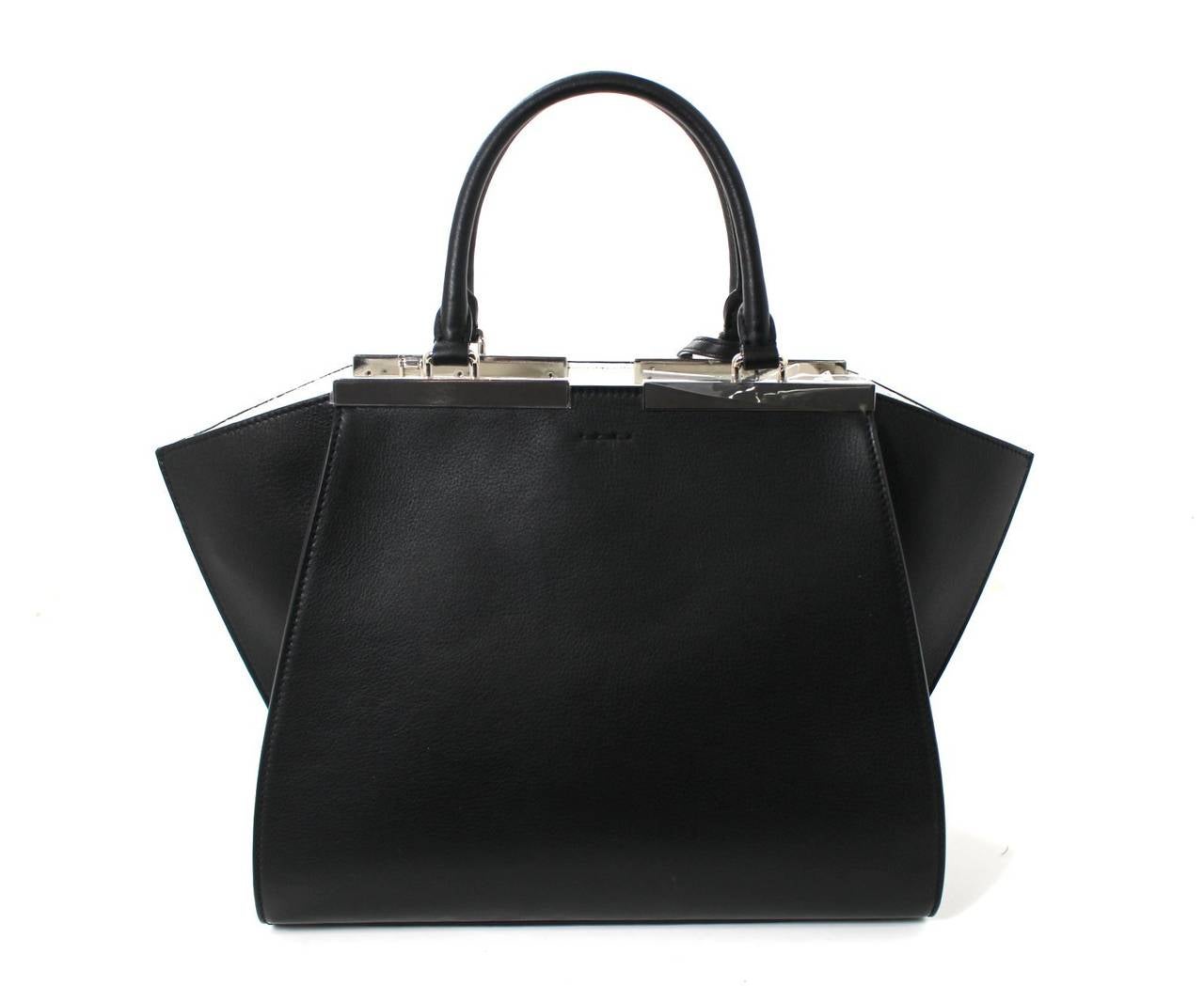PRISTINE condition, Never Carried- FENDI TroisJours Shopper in Black Calfskin with White interior
Fendi card, care booklet, clochette with mirror, optional strap and Fendi dust bag included.
Current style retailing for over $2,650.00 with taxes. 