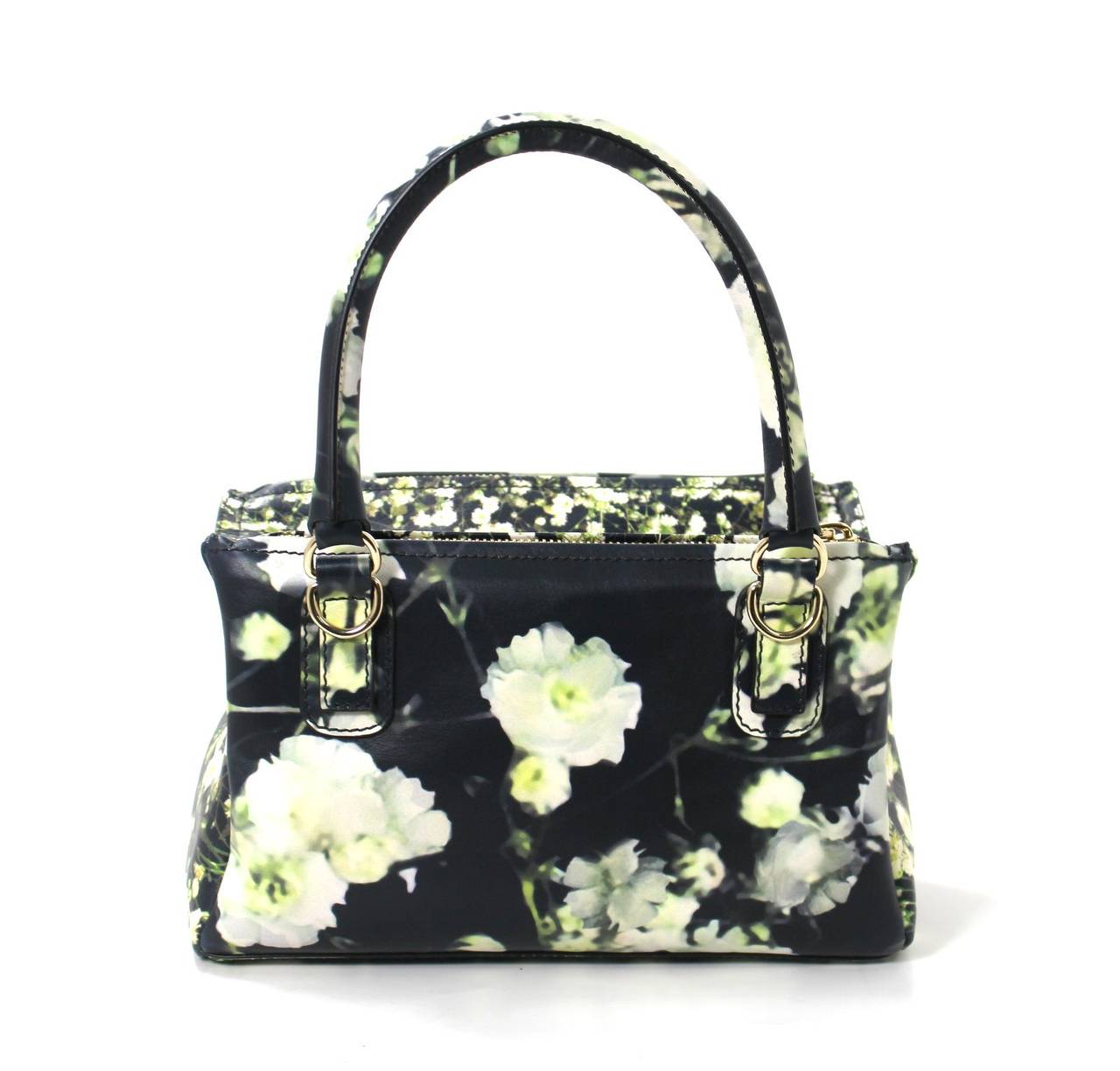 PRISTINE condition, Never Carried- GIVENCHY Baby’s Breath Pandora Messenger in Black Leather with Flowers
Givenchy care booklet, optional strap and Givenchy dust bag included.  Current style retailing for over $2,250.00 with taxes.  
Black nappa