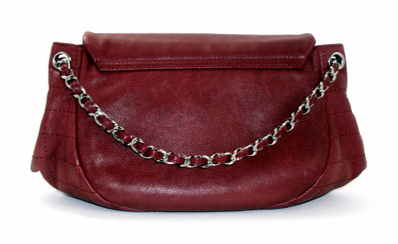 Chanel’s Wine Caviar Leather Half Moon Flap Bag is a fantastic find in pristine condition.  Perfect for every day, the Half Moon combines many of the classic Chanel design elements with a softly rounded silhouette.  Plenty of room for the daily