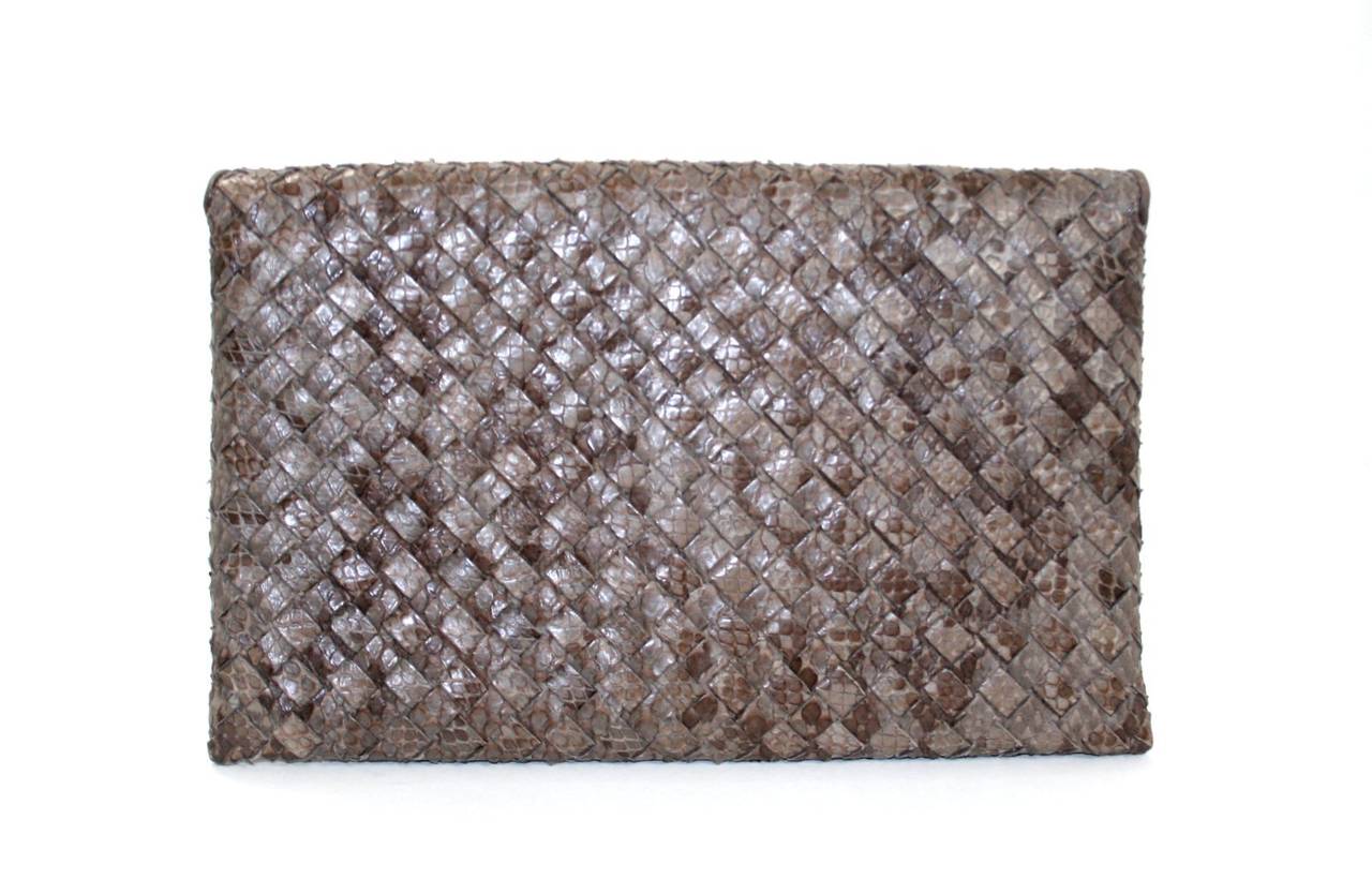 Bottega Veneta’s Ash Python Envelope Clutch is a store return in new condition.  Totally neutral, this piece is certain to become a favorite in any collection.  Similar BV exotic styles currently retail for over $2,500.00 with taxes.  Exotics hold