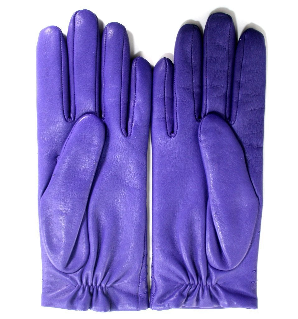 Pristine and never worn, these authentic Hermès Women’s Leather Gloves are beautiful and practical.  Warm cashmere lining makes them perfect for driving or walking outdoors.

Regal purple lambskin, known as Iris, has subtle tonal stitching.  Lined
