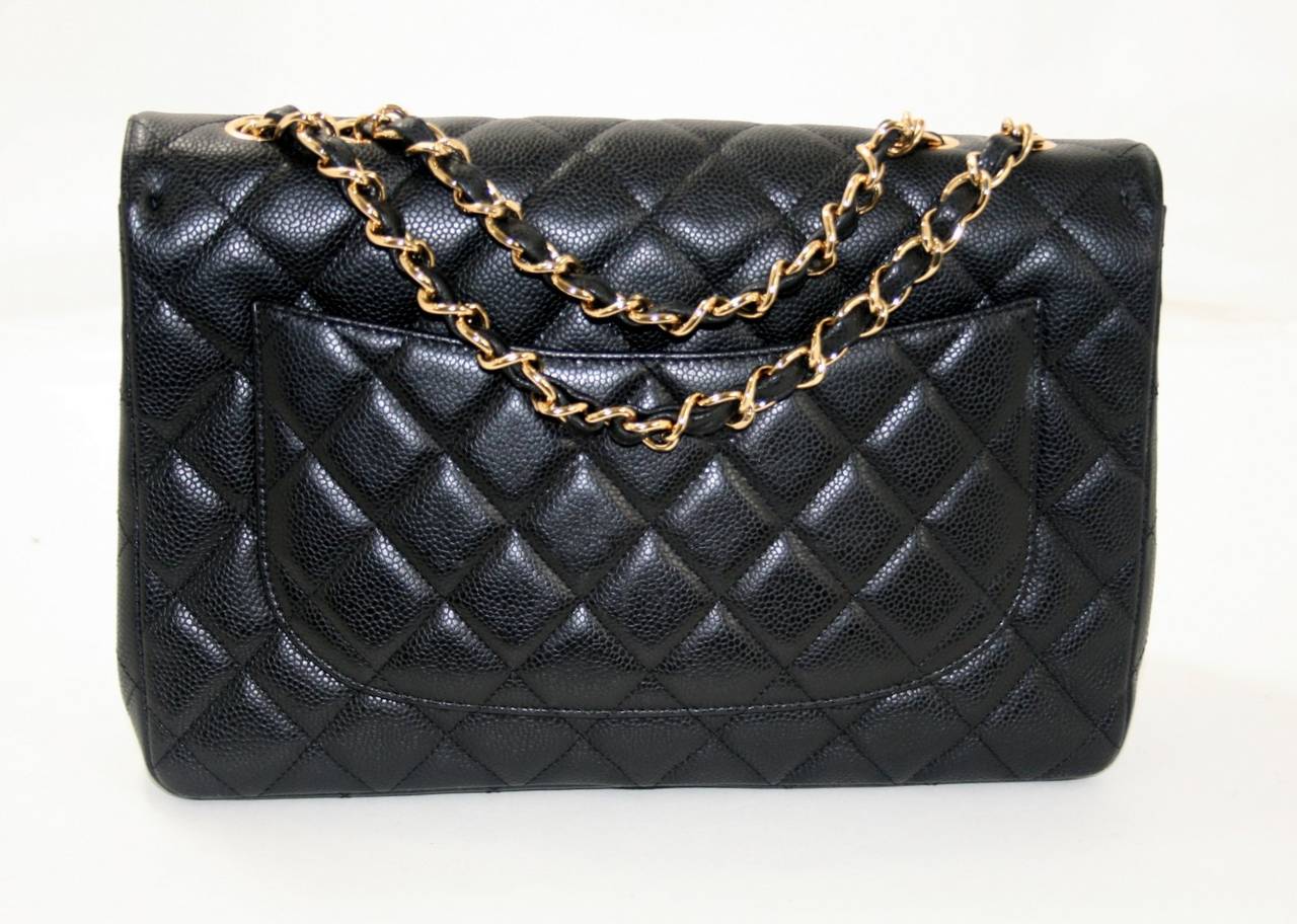 Chanel’s Black Caviar Jumbo Classic is a beautiful style in mint condition.  The cornerstone of any sophisticated collection, a black Jumbo Classic with gold hardware is a must have. The current retail is over $5,500.00 with taxes; this is a
