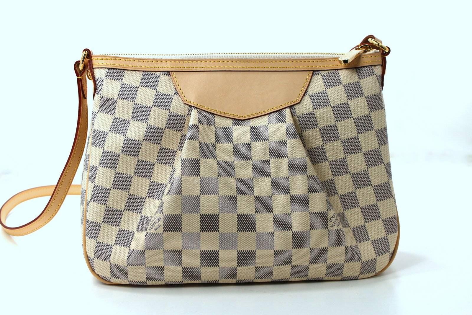MINT CONDITION Louis Vuitton Damier Azur Siracusa PM Crossbody Bag

  Carried maybe once; no signs of wear.
  Current LV style carried cross body or on the shoulder.  Retail over $1,270.00 with taxes.  This is the PM size, yet it is quite roomy
