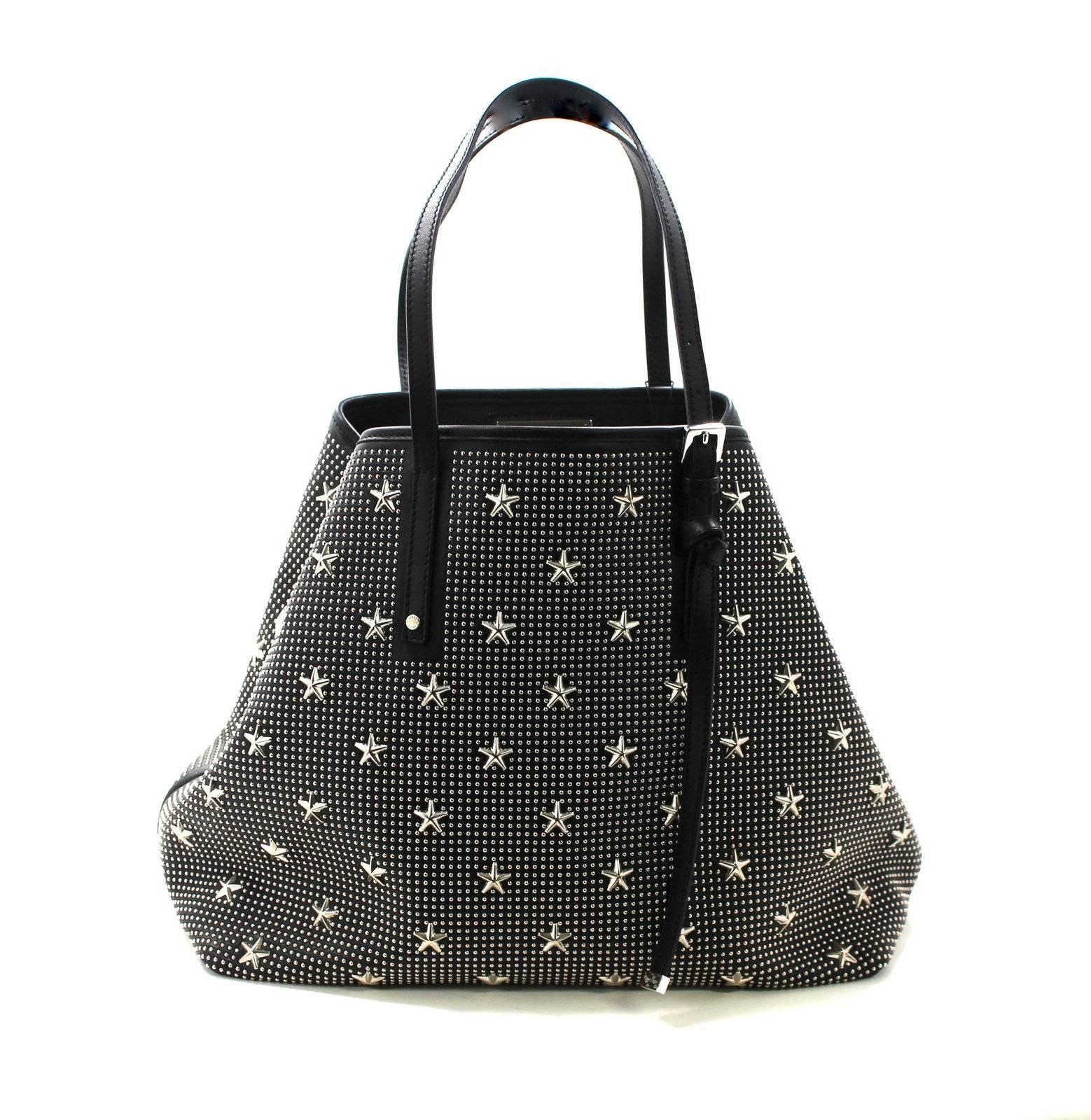 Brand new, never before carried JIMMY CHOO SASHA Tote in Black Leather with Silver Star Studded pattern.  Retail price $2,230.00.

Black leather tote is covered with silver tone studs and stars.  Sides tuck in to alter the shape via the bridge