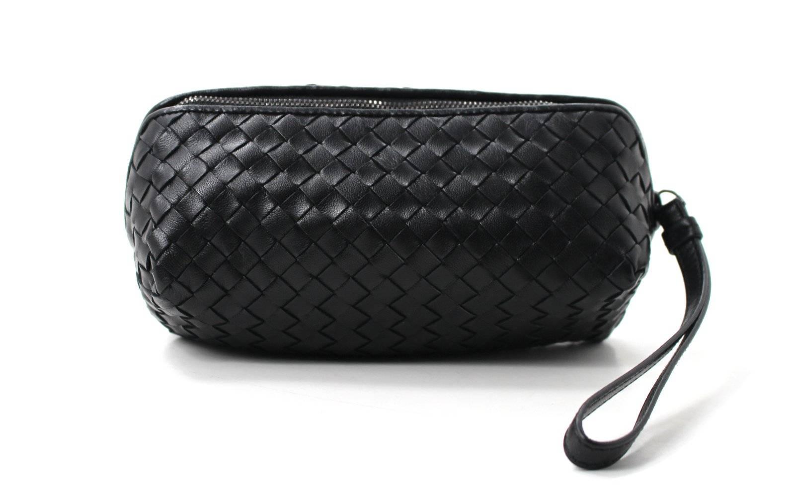 PRISTINE, New Condition- Bottega Veneta Black Leather Cosmetic Case/ Wristlet
Versatile and practical, this BV is equally at home carried on the wrist for a night out or tossed inside a larger tote.  Similar Bottega styles retail over