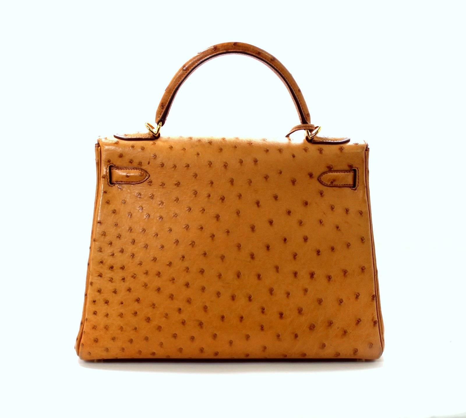 
EXCELLENT condition-   Hermès Kelly Bag in SAFFRON OSTRICH Skin with Gold Hardware, 32 cm size
Minor signs of wear on corners.  
Crafted by hand and considered by many as the epitome of luxury items, the classic Kelly bag is a highly coveted