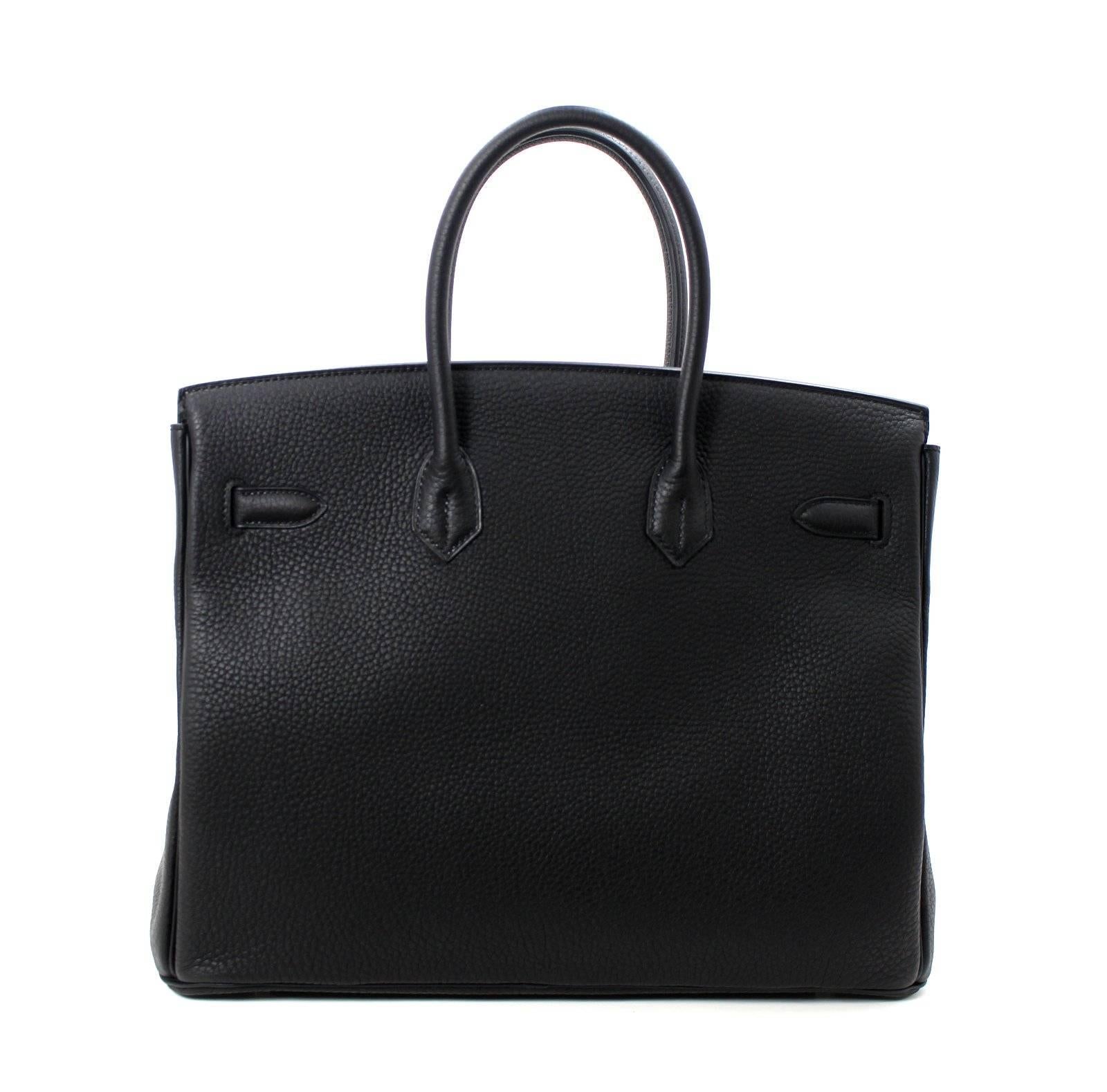 Pristine, store fresh condition (plastic on hardware) Hermès Birkin Bag in BLACK Togo, PHW 35 cm, T stamp
Purchase includes padlock, keys, clochette, protective felt, raincoat, dust bags and Hermès box with tissue. 
Crafted by hand and