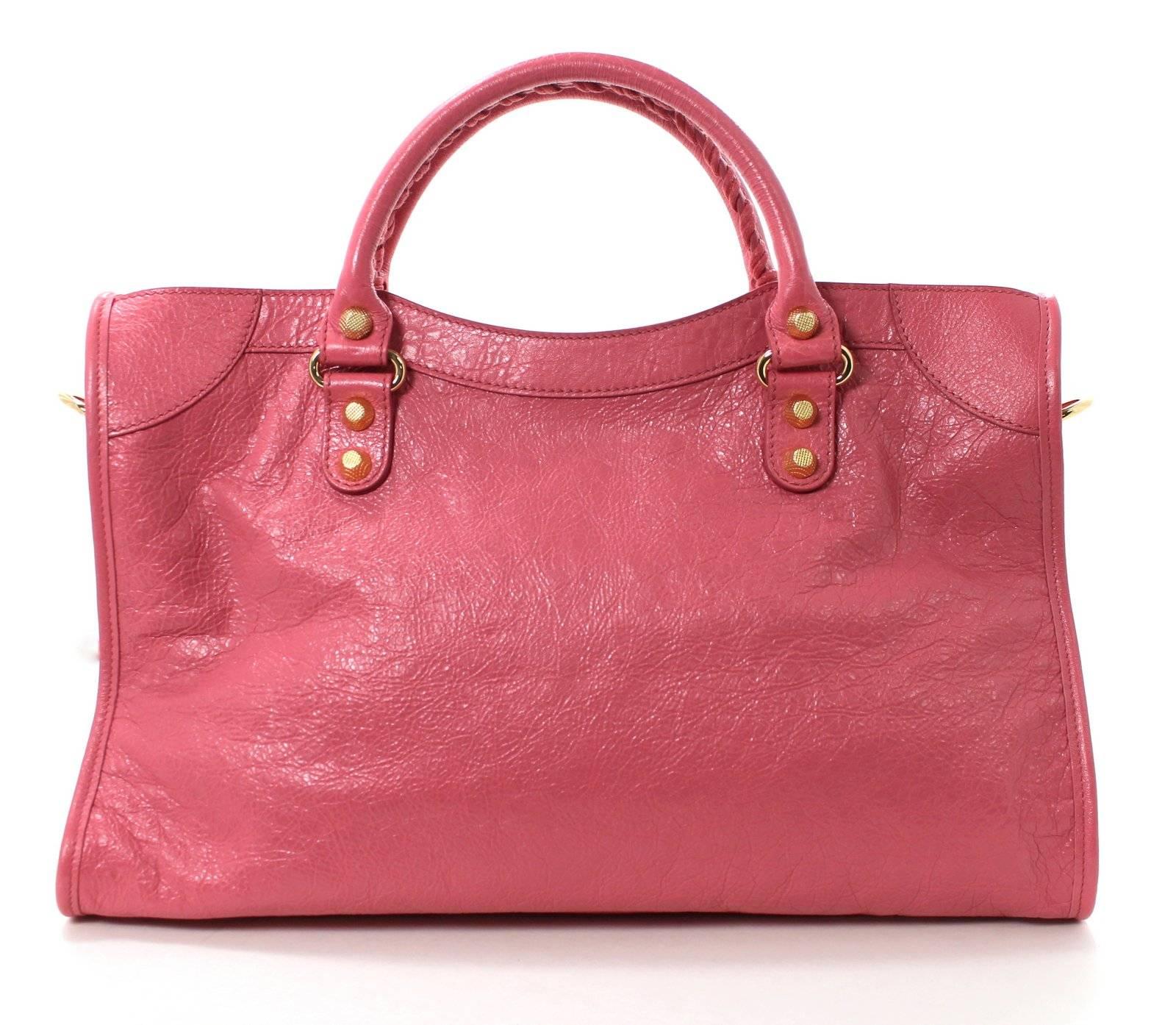 Balenciaga Rose Hortensia Lambskin Arena City Bag with GIANT Gold Hardware- NEW; retail $1,985.00 plus taxes

The iconic Balenciaga silhouette is recreated each season in exciting new colors.  The City Bag, or Motorcycle Bag, is particularly