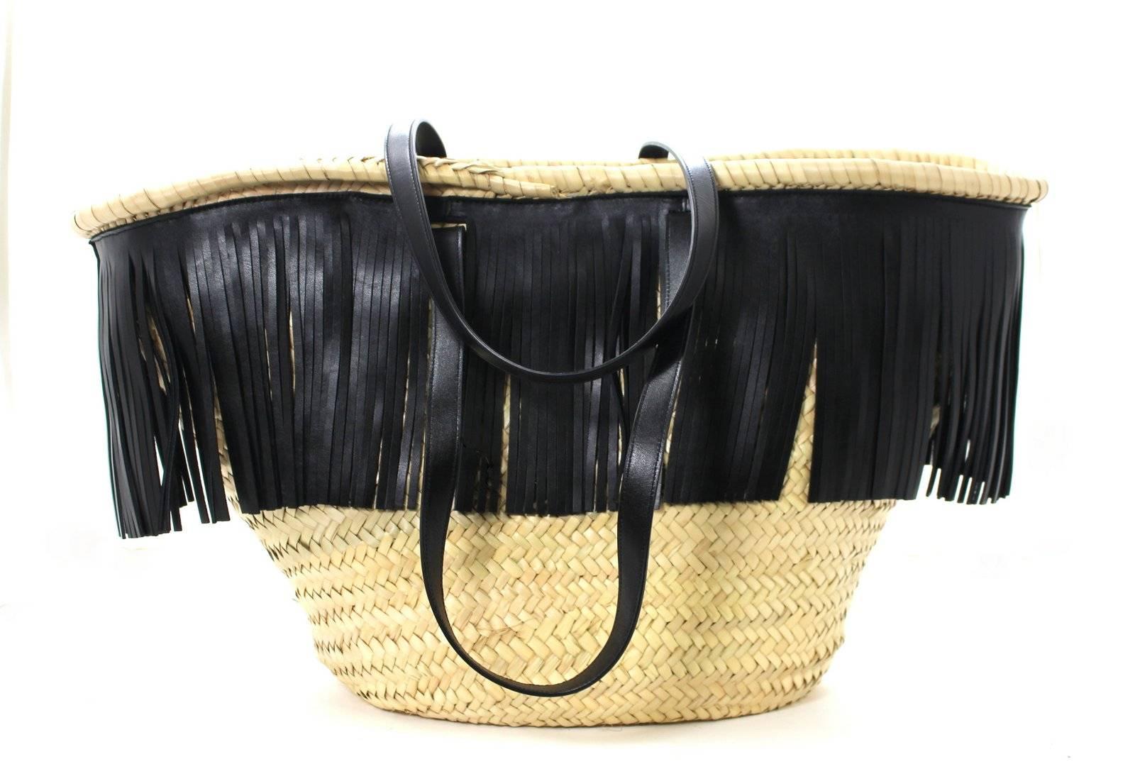 Saint Laurent Large Panier Straw Tote- NEW; sold out!! Retail $1,190.00
Saint Laurent 2016 collection 
Large natural straw basket tote is trimmed with black leather fringe and handles.  Black fabric drawstring lining is fully removable.  Double