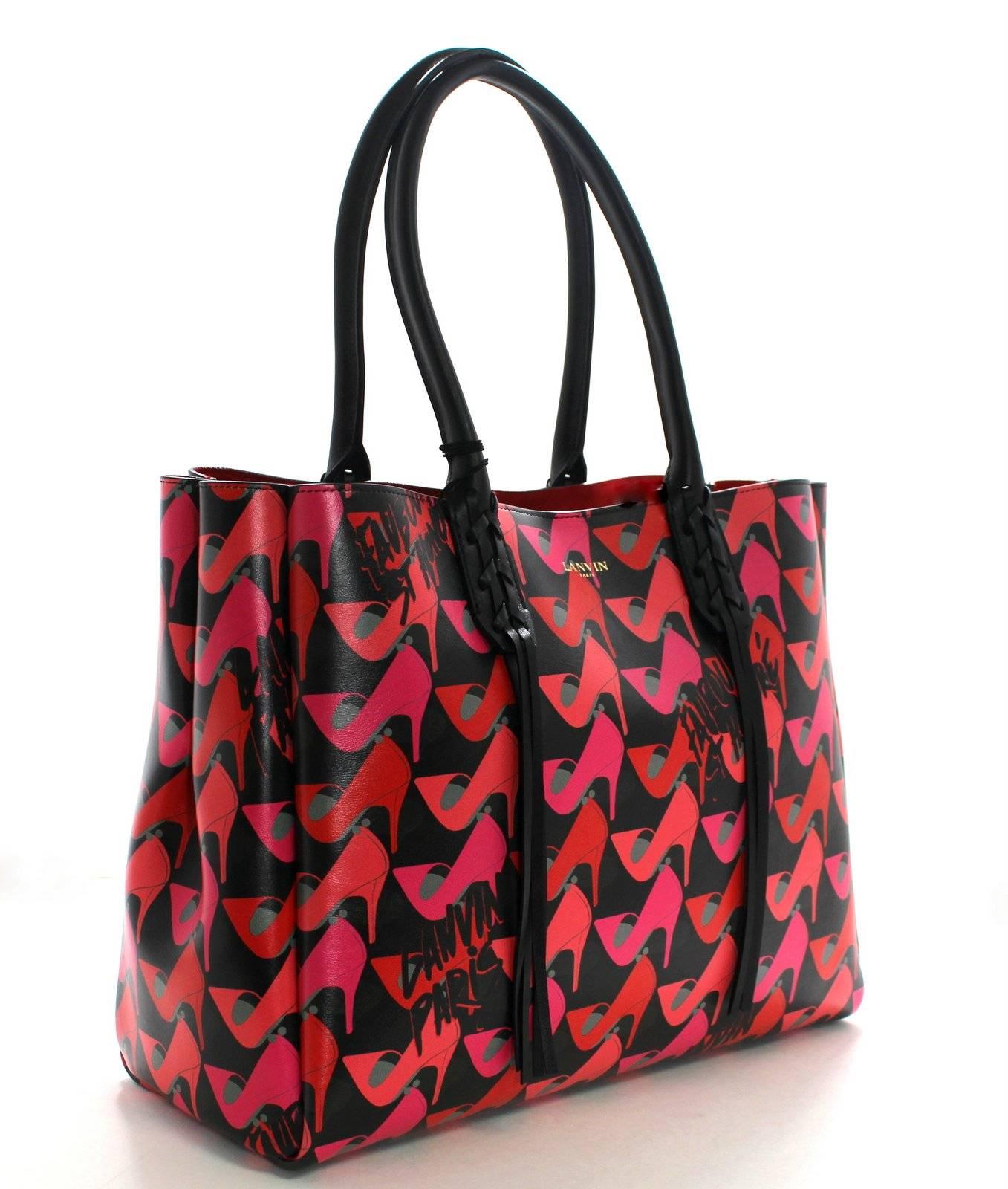 Lanvin Black and Pink Leather Shoe Print Tote- NEW; Retail $1,850.00
Stunning and unique graphic print in bold colors.  So much more interesting than basic black!!
Black calf leather tote is covered with pink and red pumps in a striking graphic
