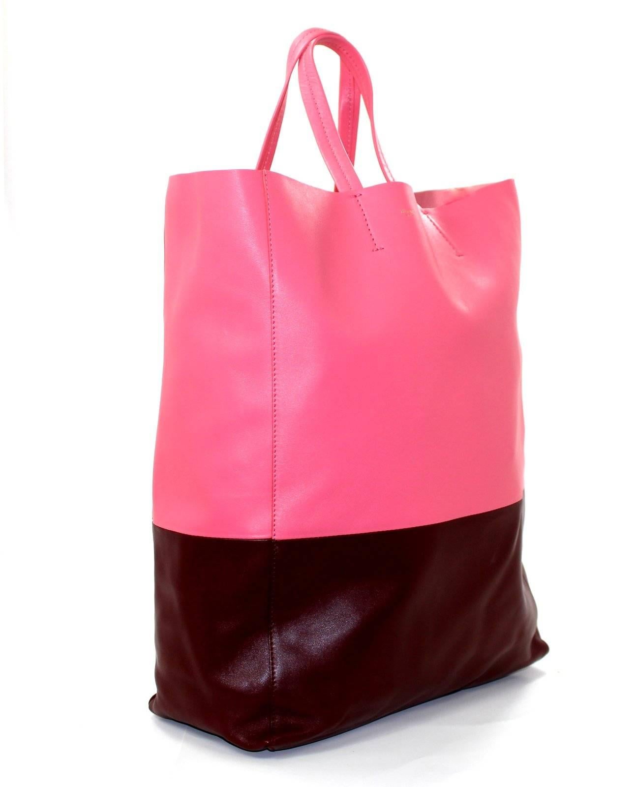 Celine Pink and Burgundy Cabas Tote- Brand New,  Retail $1200.00

Lambskin Cabas Tote from Celine in extremely desirable colors- Raspberry Pink and Deep Burgundy Rust.   The unique pairing is remarkably wearable throughout the year.  Imagine white